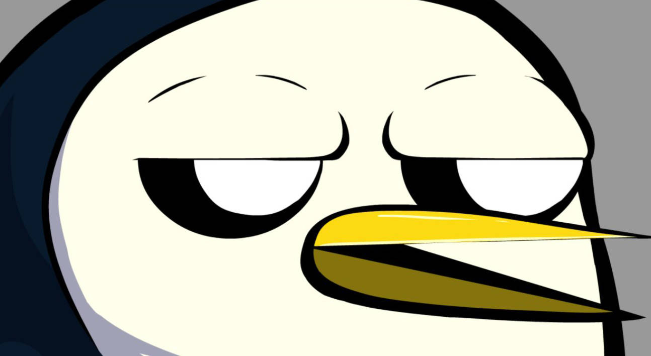 Gunter 冒險時光特寫 壁紙 — 卡通企鵝的近距離特寫，瞇著眼睛，黃色喙，在灰色背景下看起來很惱火。