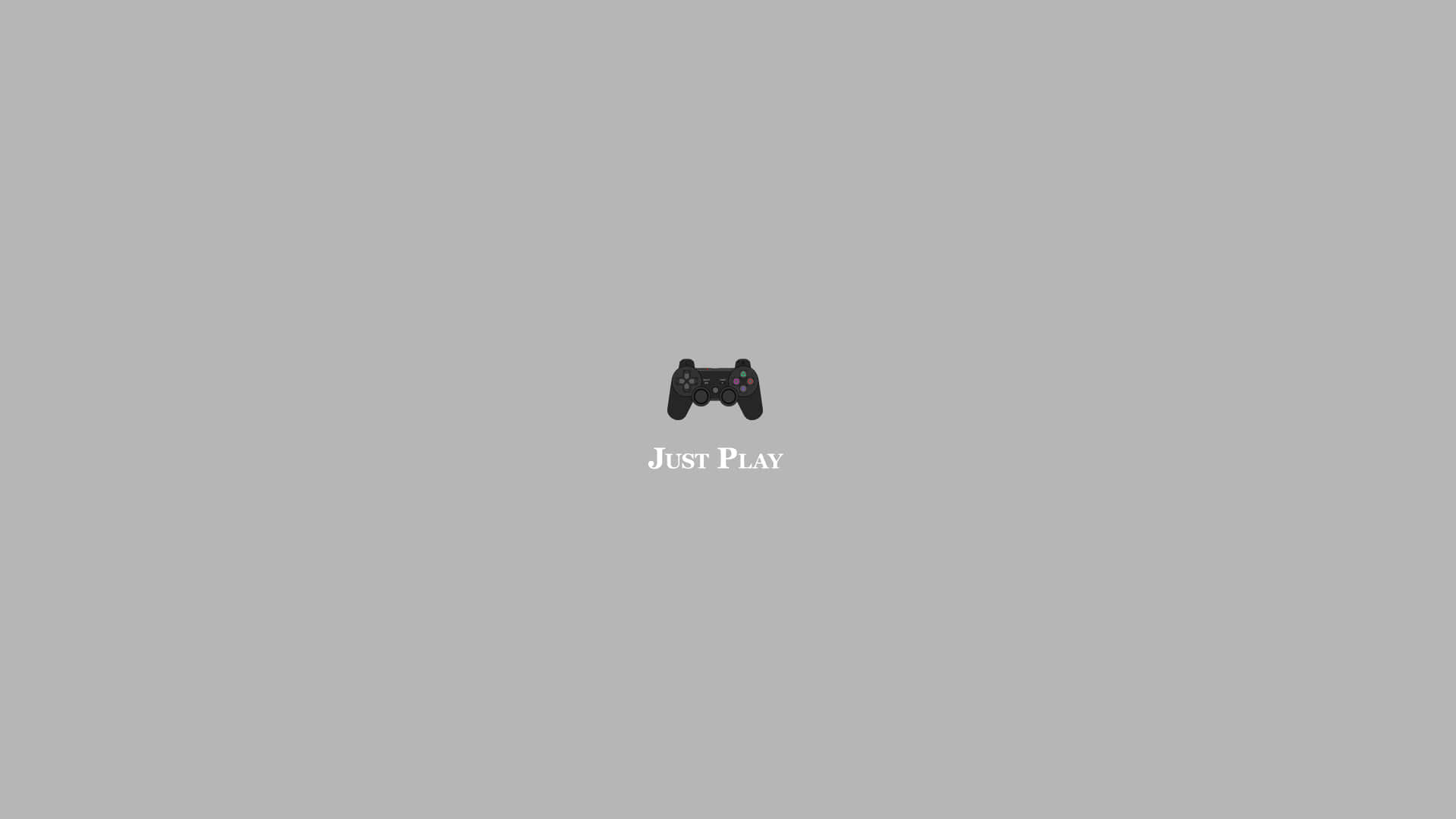  壁紙 — 一個黑色電玩遊戲手掣置於純灰色背景中央，下方有「Just Play」文字。