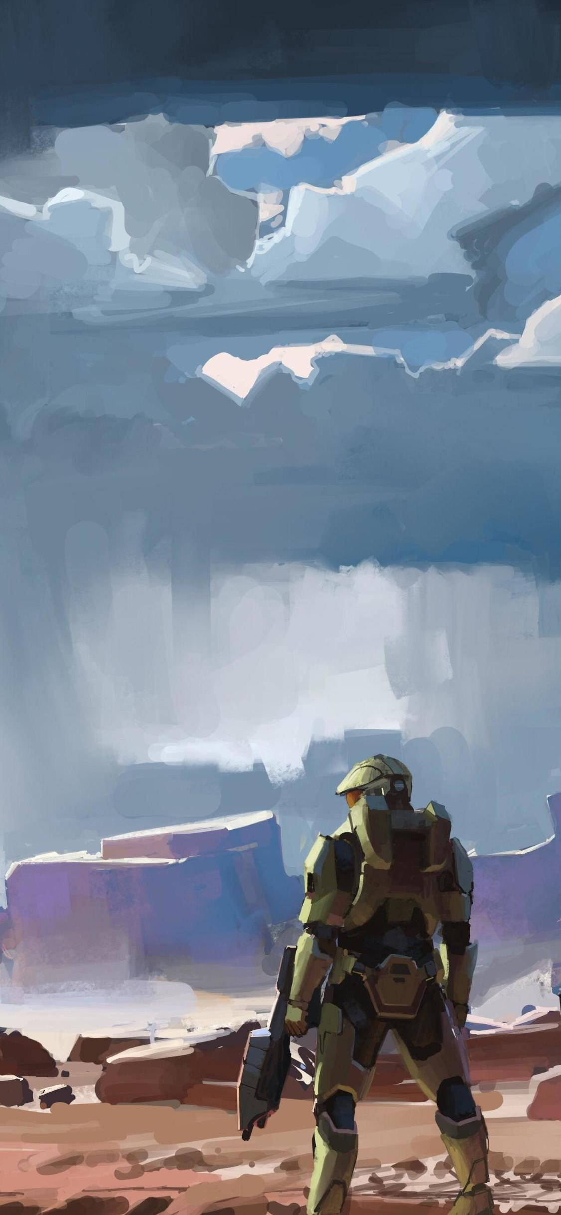 Halo Infinite 數位藝術 壁紙 — 一個孤獨的裝甲士兵站在荒涼的外星峽谷中，天空風暴密佈，雲層參差不齊。