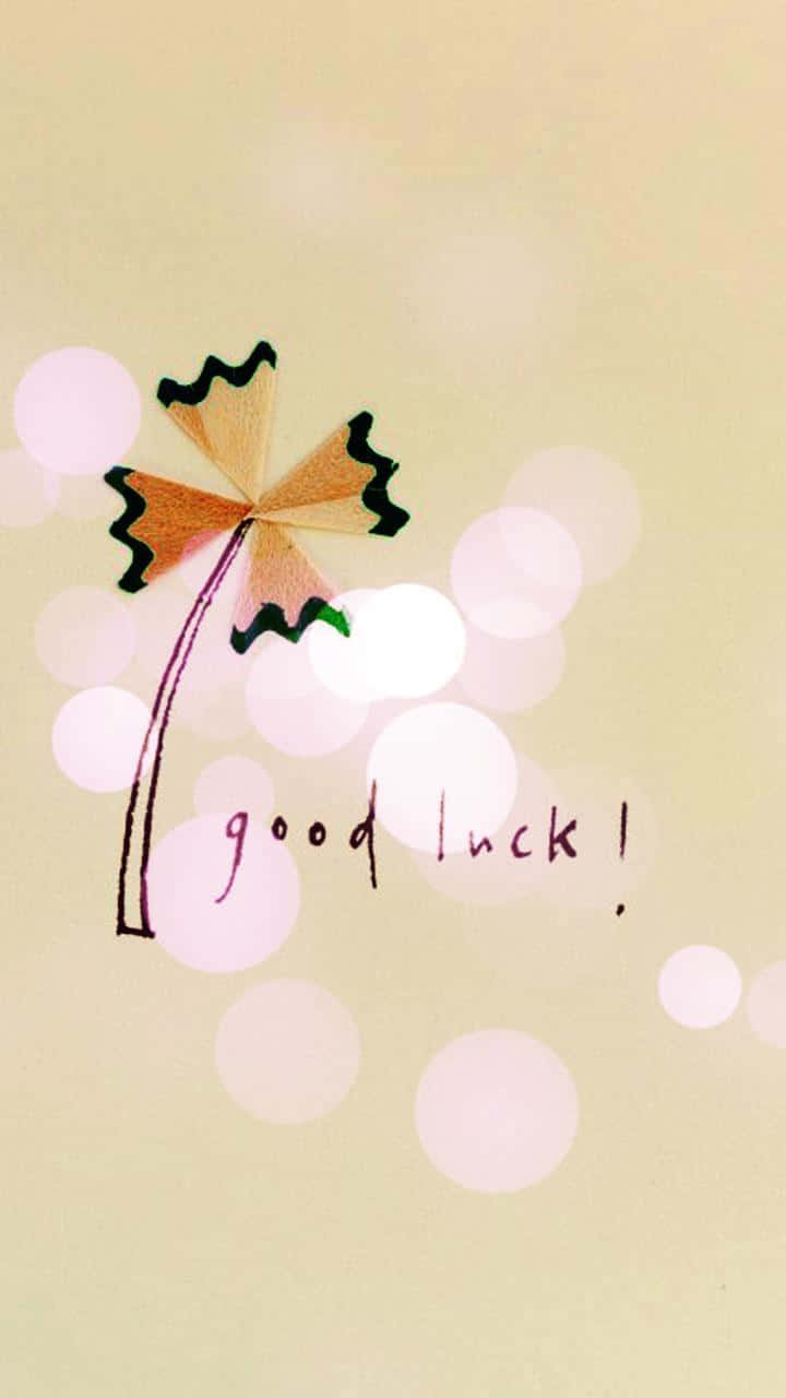  壁紙 — 一棵手繪的棕櫚樹，帶有鉛筆陰影的葉子和「good luck!」文字，背景為柔和散景。
