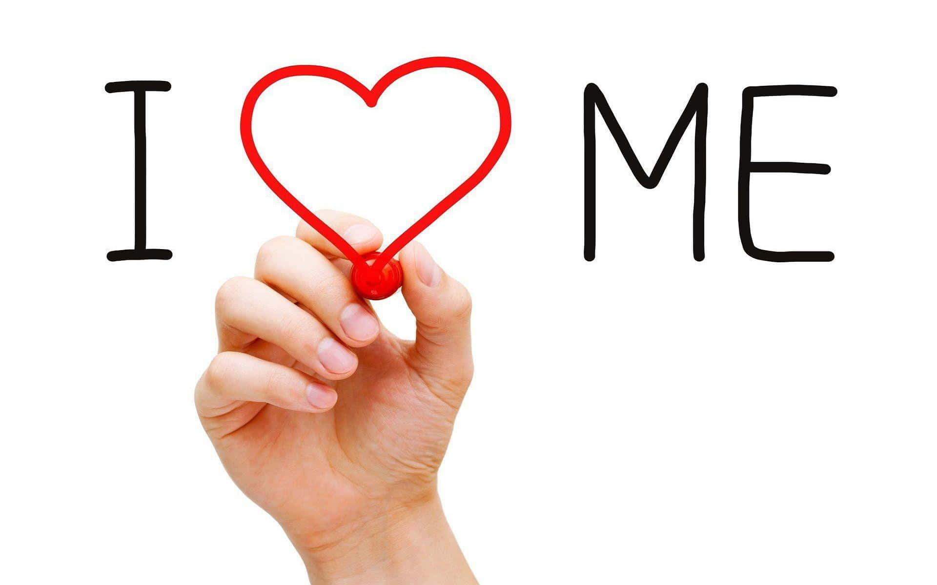  壁紙 — 一隻手拿著紅色心形記號筆，在白色背景上完成「I love me」這句話。