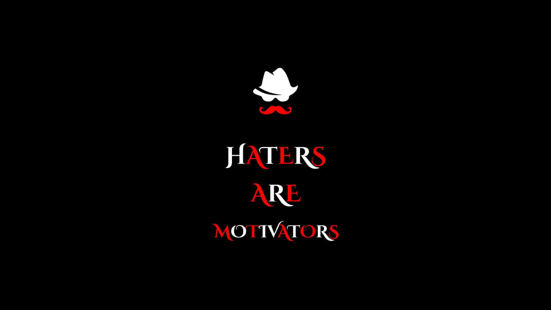  壁紙 — 黑色背景上，白色紳士帽和紅色鬍子下方，粗體文字宣告「Haters Are Motivators」。