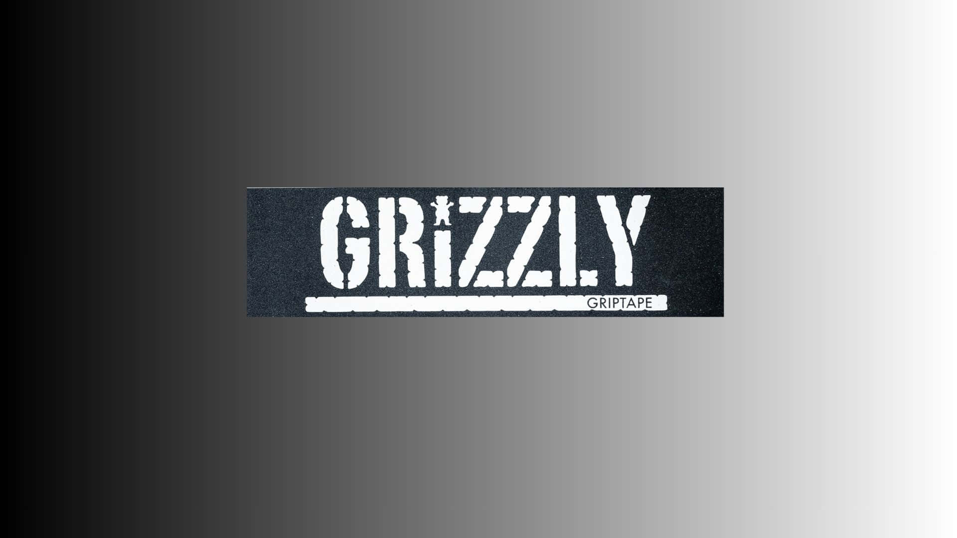  壁紙 — 一個黑色長方形砂紙標誌，帶有粗體白色 'GRIZZLY' 文字，'i' 上方有一顆小星星，背景為平滑漸變灰色。