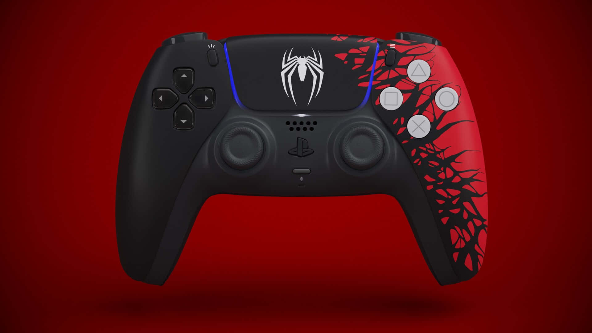  壁紙 — 一個黑色PlayStation 5控制器，帶有紅黑蜘蛛主題藝術品，背景為純紅色。