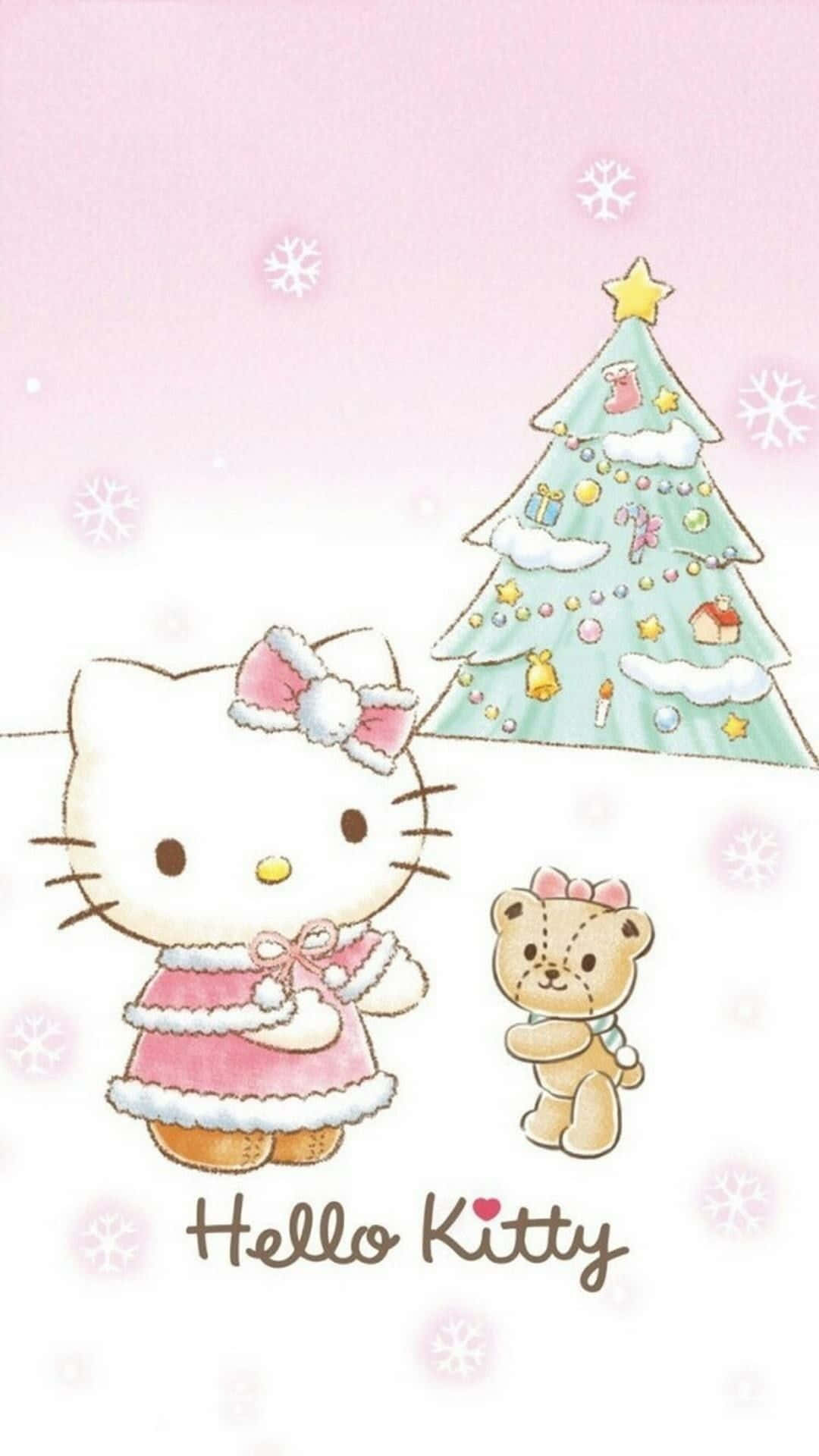 Hello Kitty Christmas 桌布 壁紙 — Hello Kitty 和一個泰迪熊站在裝飾好的聖誕樹旁，背景是柔和的粉紅色，雪花飄落。