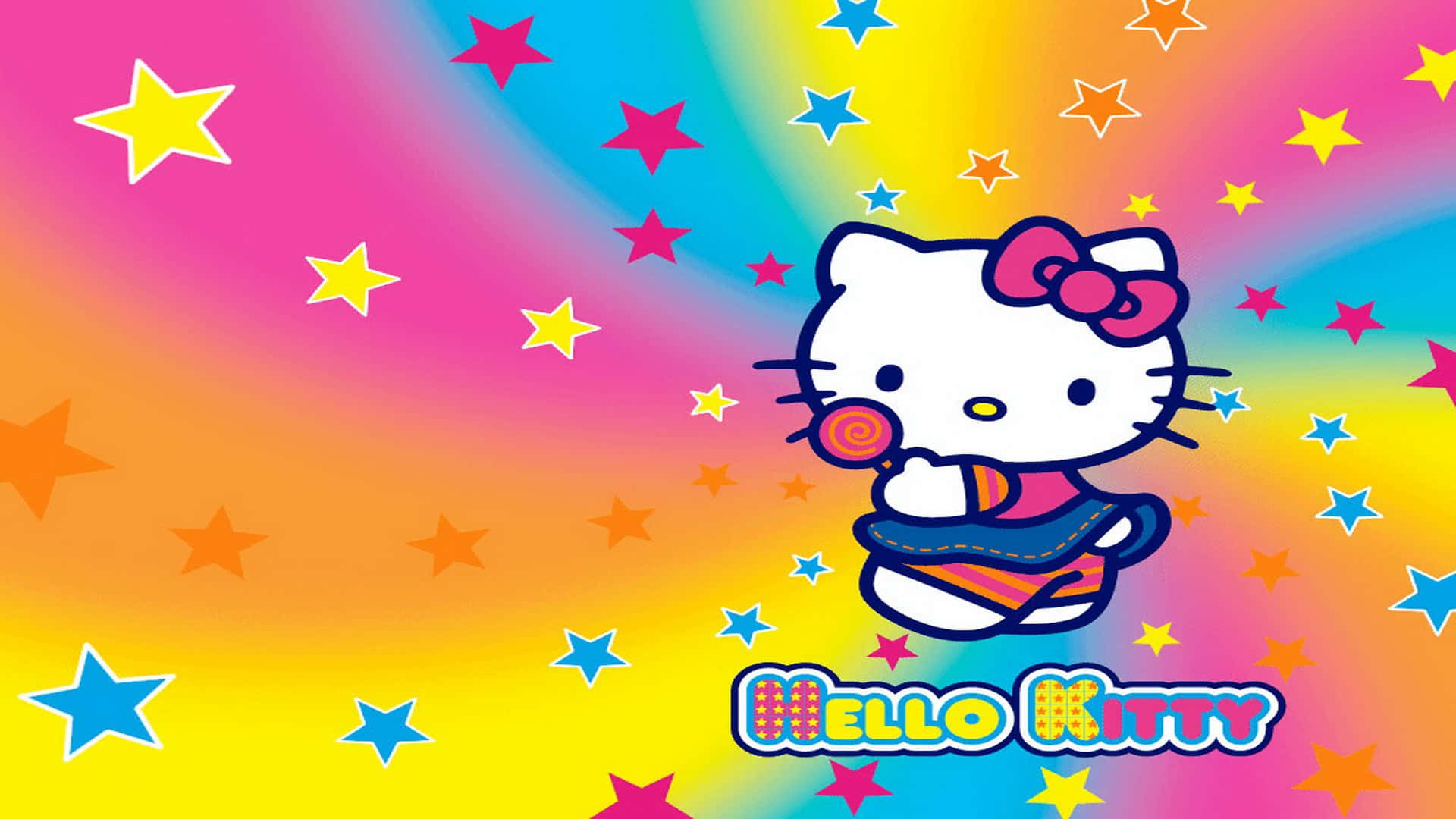 Hello Kitty 彩虹螺旋背景 壁紙 — Hello Kitty 喺充滿彩色星星嘅鮮豔彩虹背景前拎住一支棒棒糖。