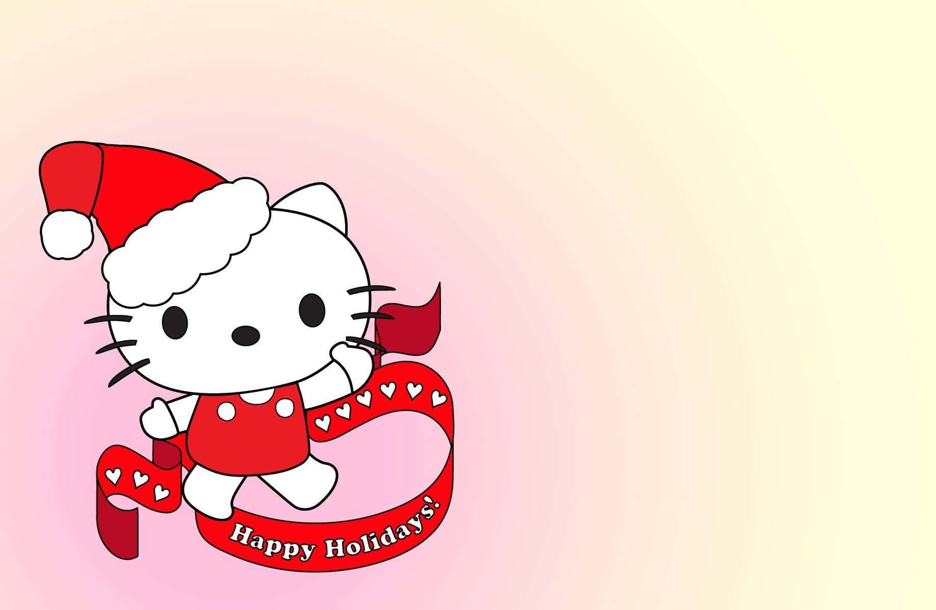 Hello Kitty Christmas 桌布 壁紙 — Hello Kitty 戴著紅色聖誕帽，手持一條帶有心形圖案和「Happy Holidays」字樣的紅色絲帶，背景是柔和的粉紅和黃色漸變。