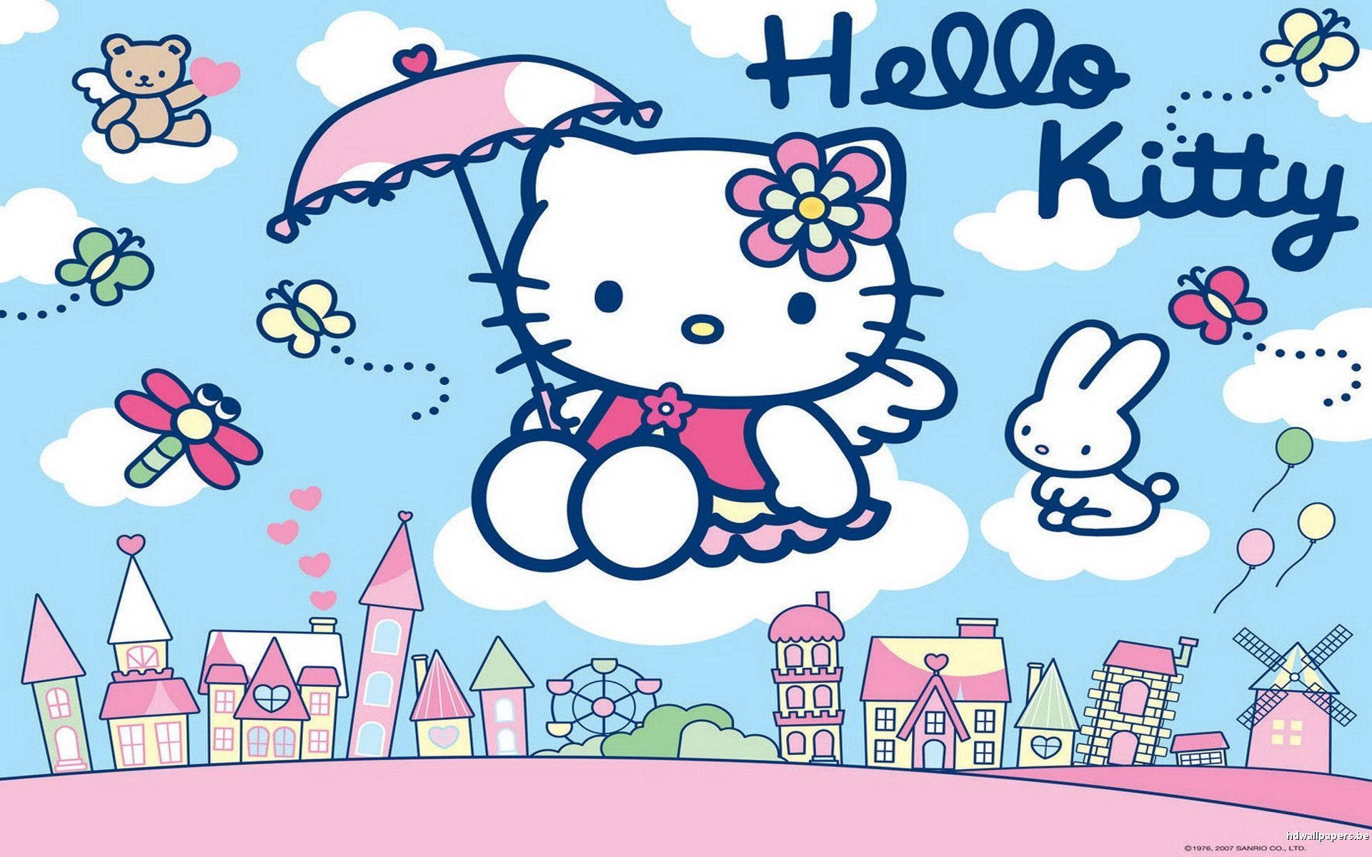 Hello Kitty 與 Rhythm 浮雲桌面 壁紙 — Hello Kitty 拿著粉紅色雨傘漂浮在一個充滿蝴蝶和糖果色房屋的夢幻粉彩小鎮上空。