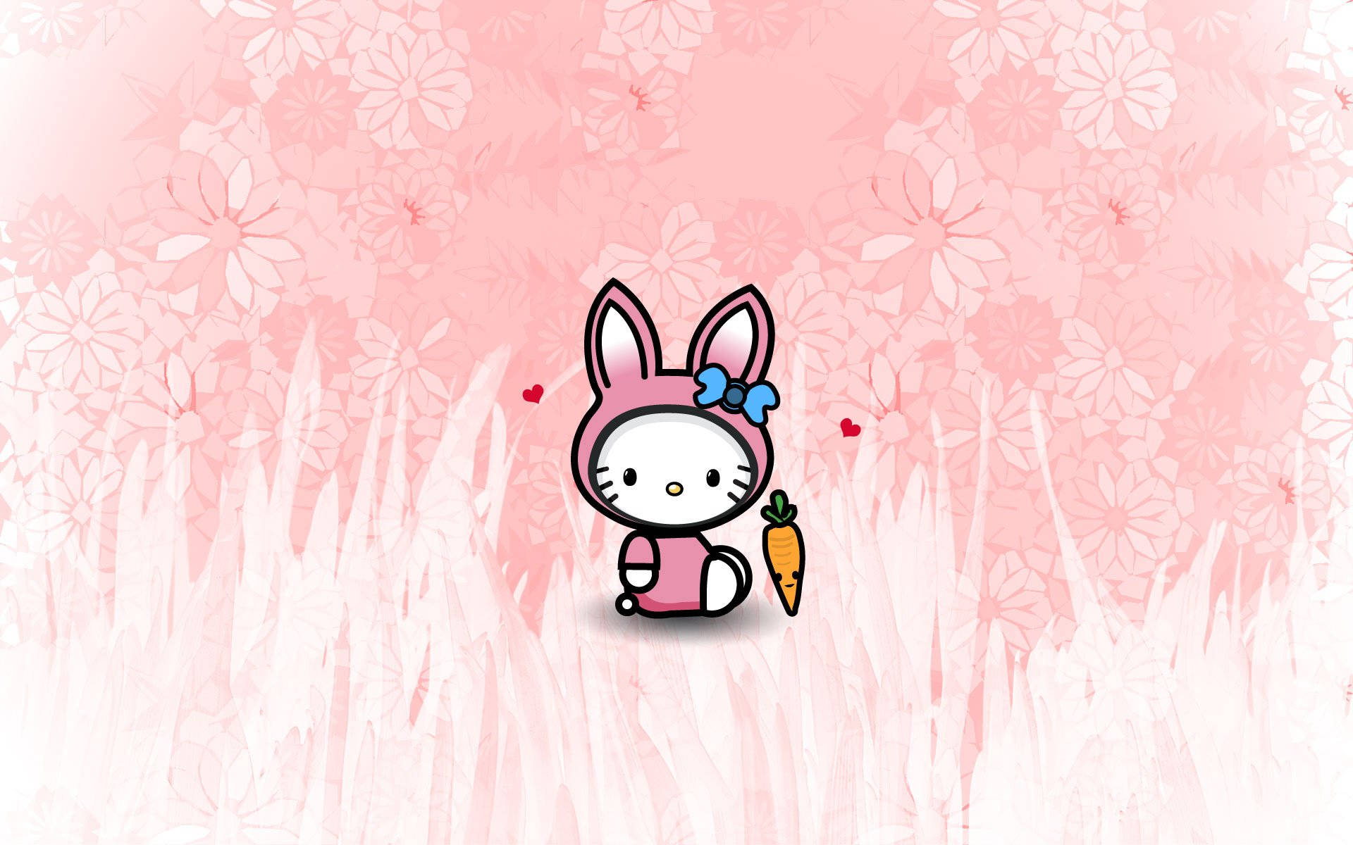 Hello Kitty兔裝桌面 壁紙 — Hello Kitty 穿著粉紅色兔仔服裝，喺柔軟嘅粉紅色花草草地中，拎住一條紅蘿蔔，周圍有漂浮嘅心心。
