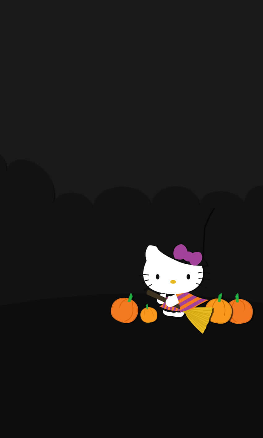 Hello Kitty慶祝感恩節！ 壁紙 — Hello Kitty 穿著女巫服裝，手持掃帚，被南瓜包圍，背景陰暗恐怖。