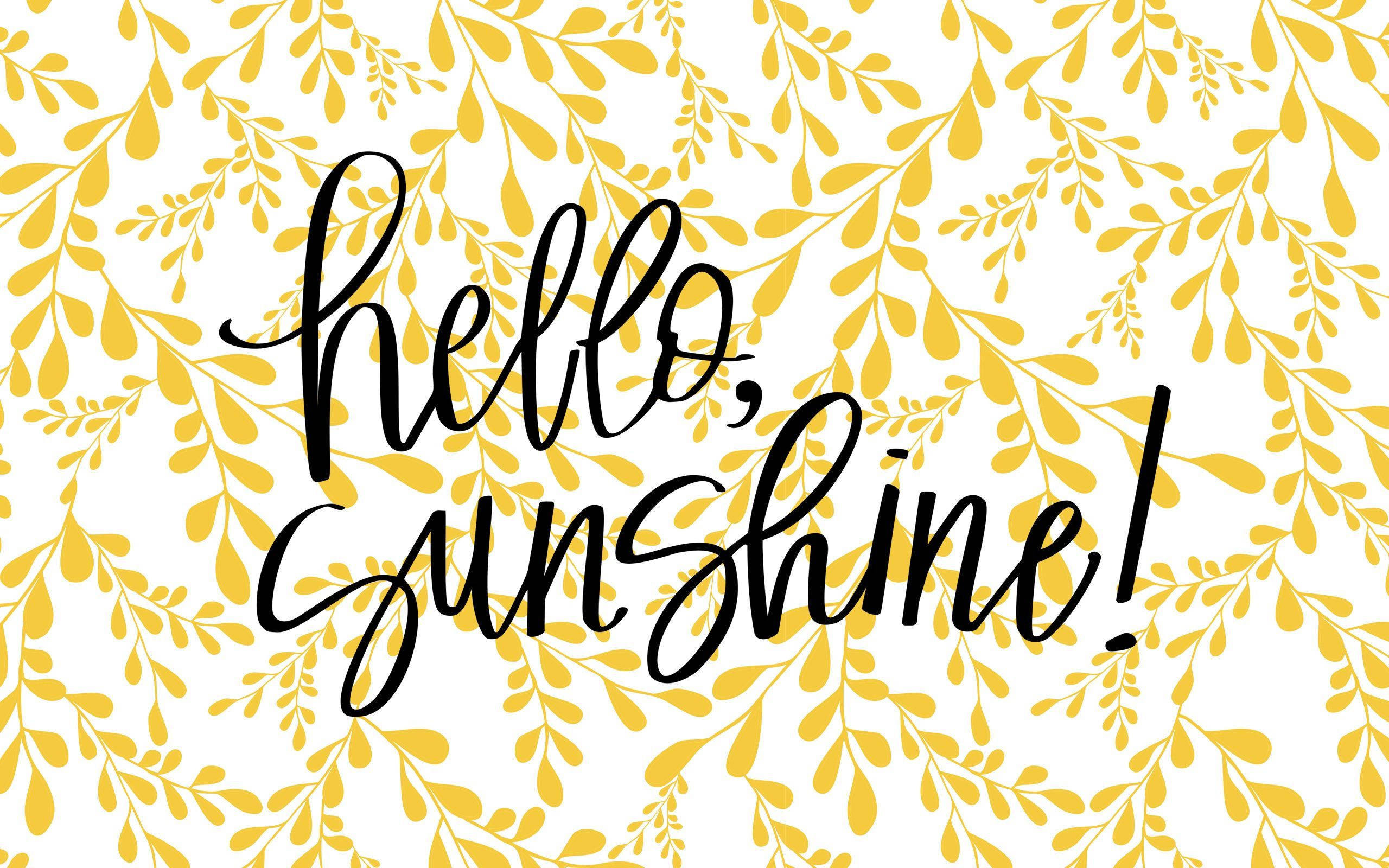 Hello Sunshine 霓虹黃花朵 壁紙 — 粗體黑色草書文字 hello sunshine 覆蓋在白色背景上歡快的黃色葉子圖案上。