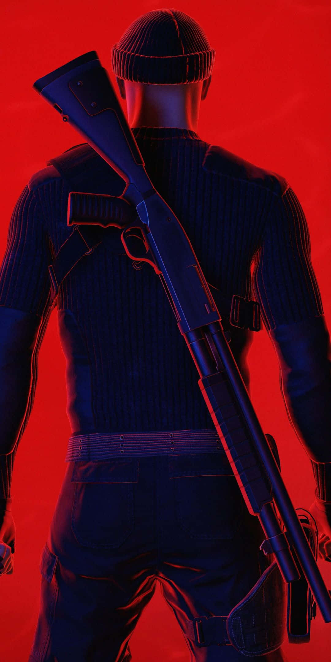 《Hitman 2》中的 47 號特工 — 現已可在 iPhone X 上遊玩 壁紙 — 一個身穿深色衣服、戴著冷帽的人物，在鮮紅色背景前將獵槍扛在肩上。