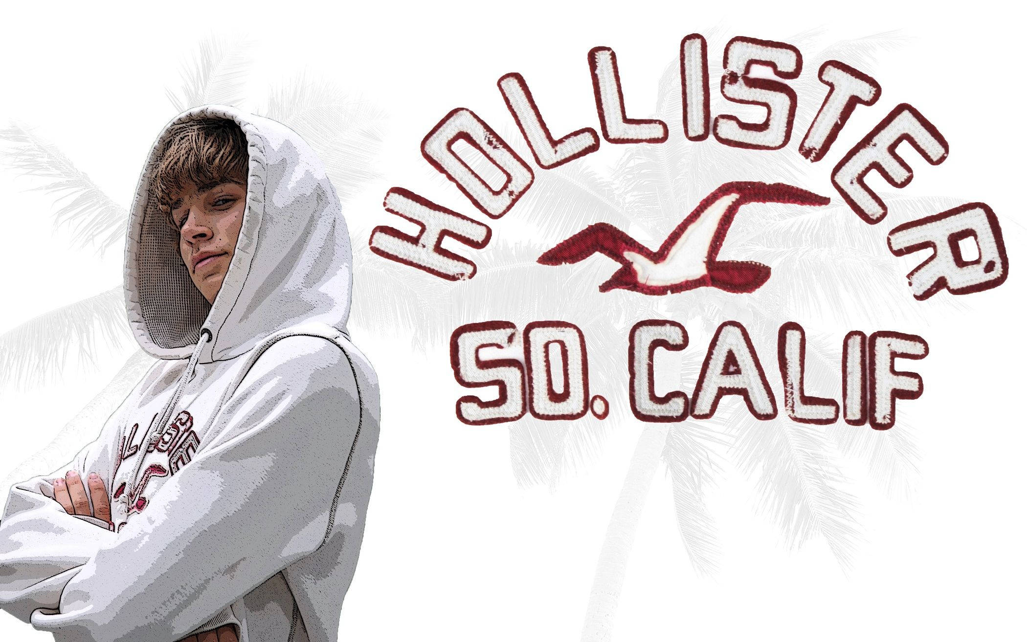 Hollister縫線徽章標誌 壁紙 — 一位穿著白色連帽衫的年輕人自信地交叉雙臂，背景是Hollister標誌和棕櫚葉。