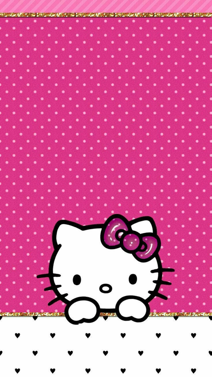 Hello Kitty身穿熱粉波點的壁紙。