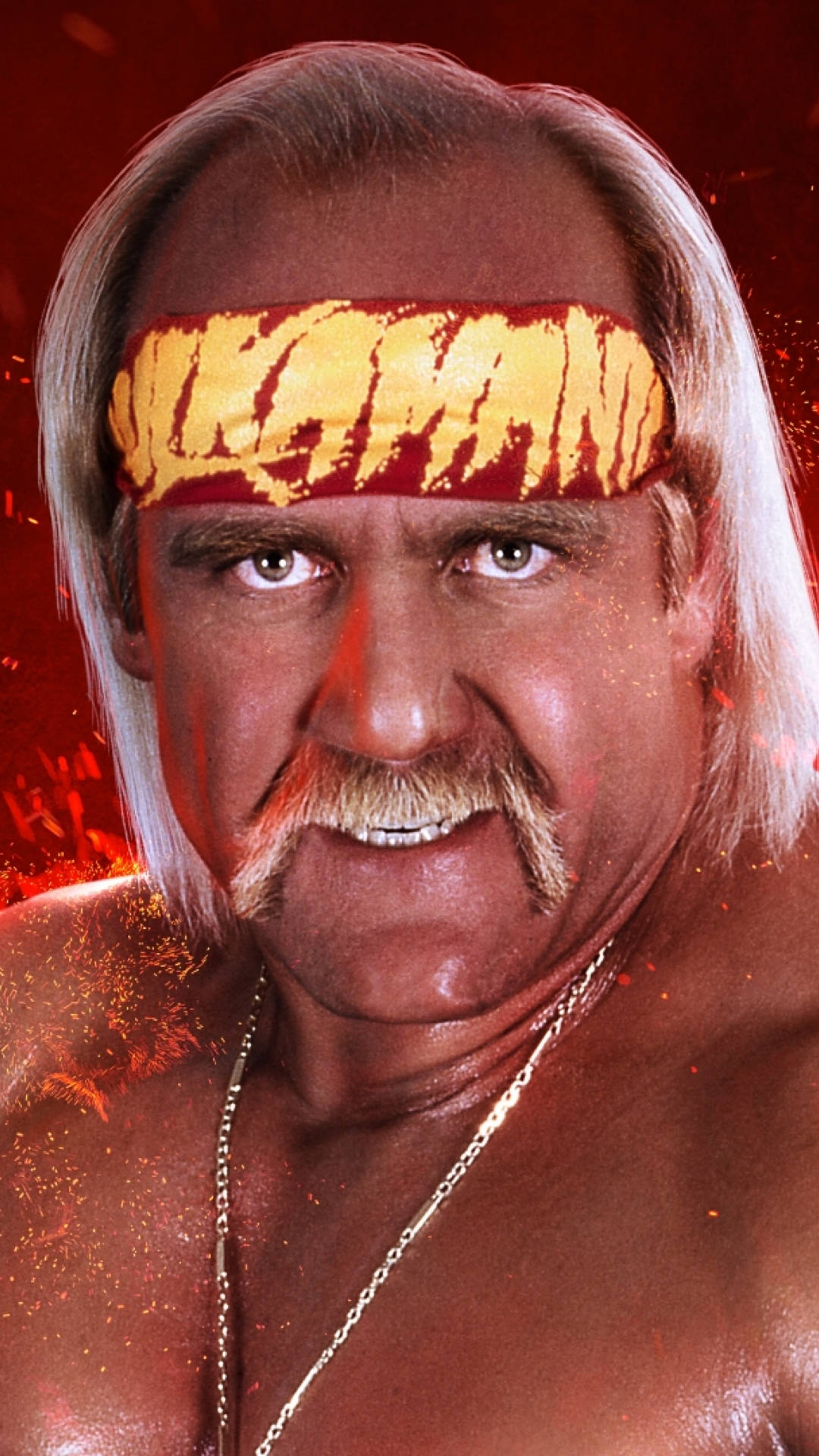 Hulk Hogan 黃色 Hulkamania 帶 壁紙 — 摔角手 Hulk Hogan 在火紅背景前，戴著標誌性的黃紅頭帶，凝視著鏡頭。