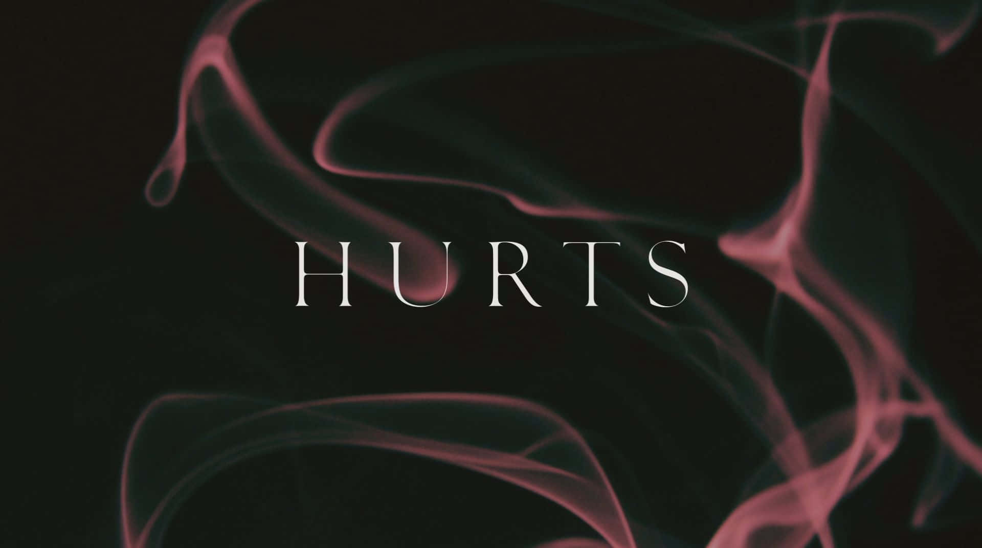 hurt 桌布 壁紙 — 「HURTS」一詞以白色襯線字體在深色背景上發光，背景中粉紅煙霧旋轉。