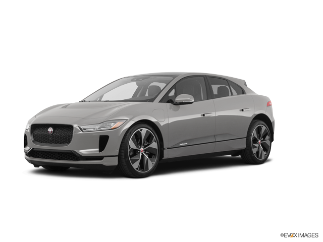 灰色捷豹I-PACE電動SUV 壁紙 — 一輛時尚的銀色Jaguar I-Pace電動SUV在工作室燈光下以純白背景展示。