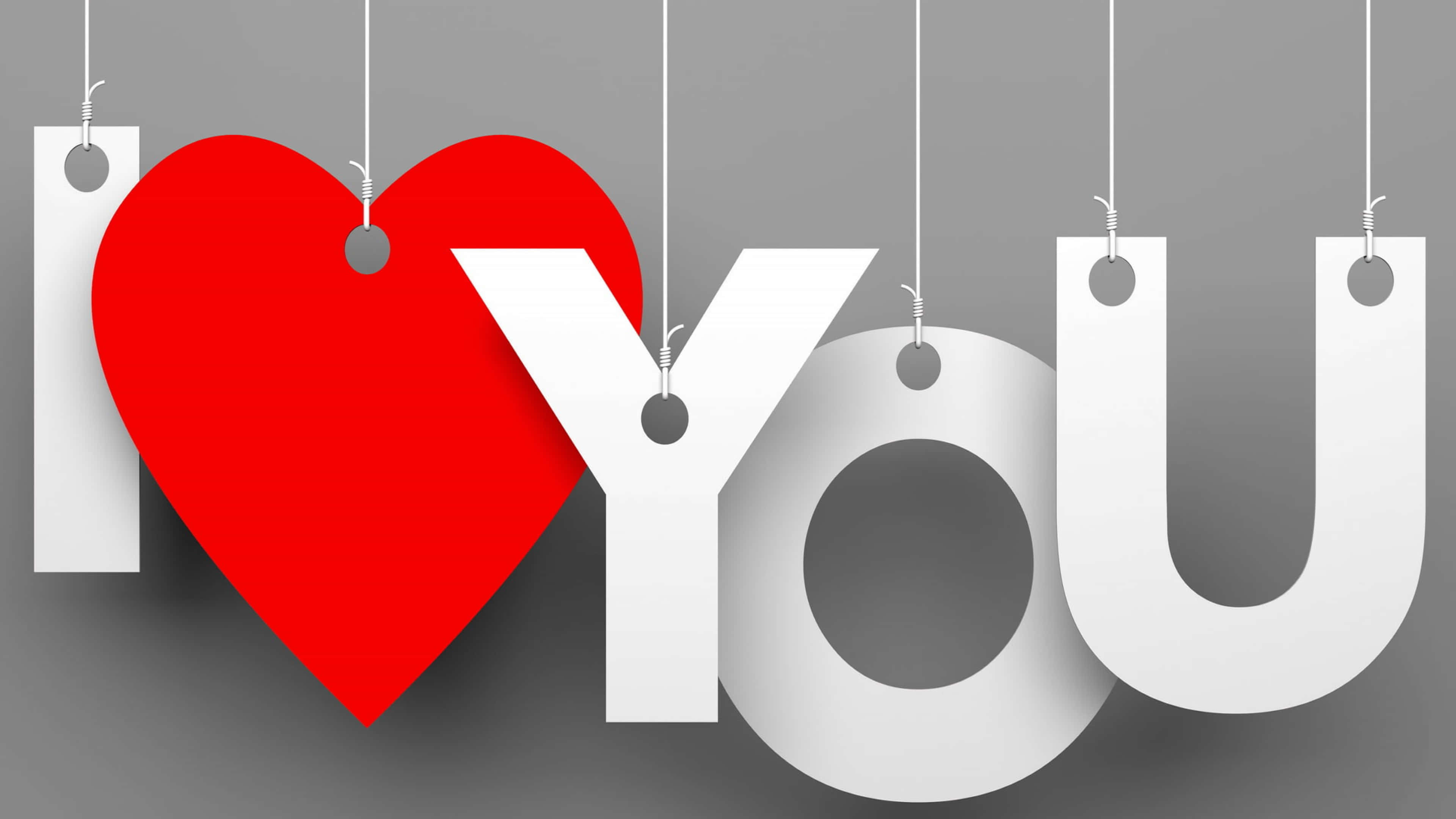 4K Love 桌布 壁紙 — 「I ❤️ YOU」呢句說話以粗體白色字母同一個鮮紅色心形懸掛喺柔和灰色背景上。