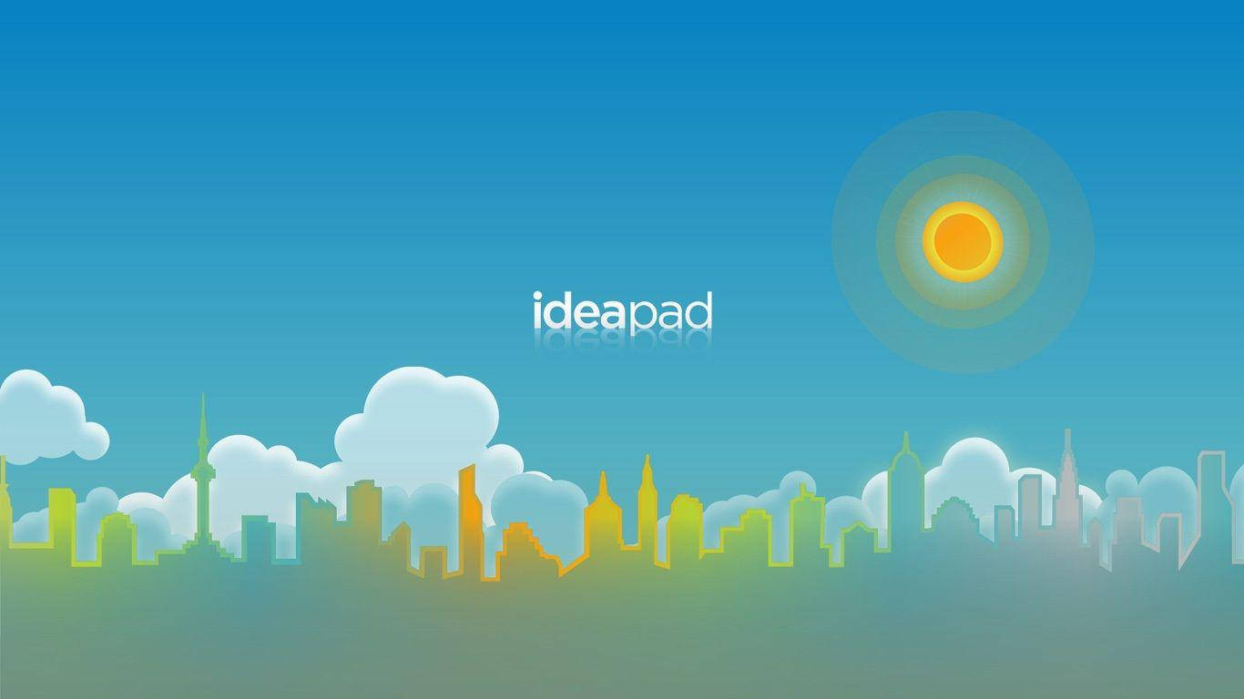 IdeaPad聯想高畫質壁紙 壁紙 — 在漸變藍色天空和發光太陽下的柔和色調風格化城市天際線剪影。