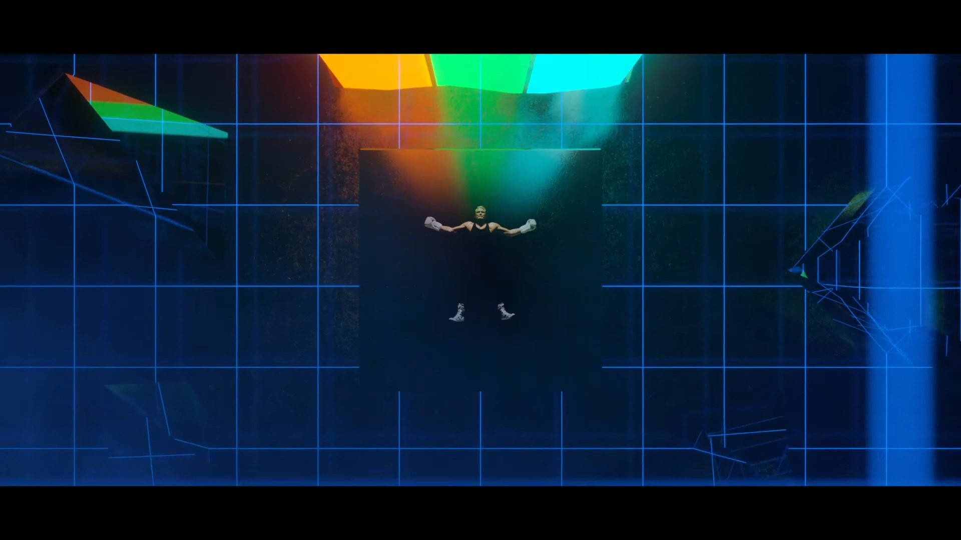 Imagine Dragons《Evolve》風格海報 壁紙 — 一個人在黑暗的網格空間中失重漂浮，被上方鮮豔的彩虹光束照亮。