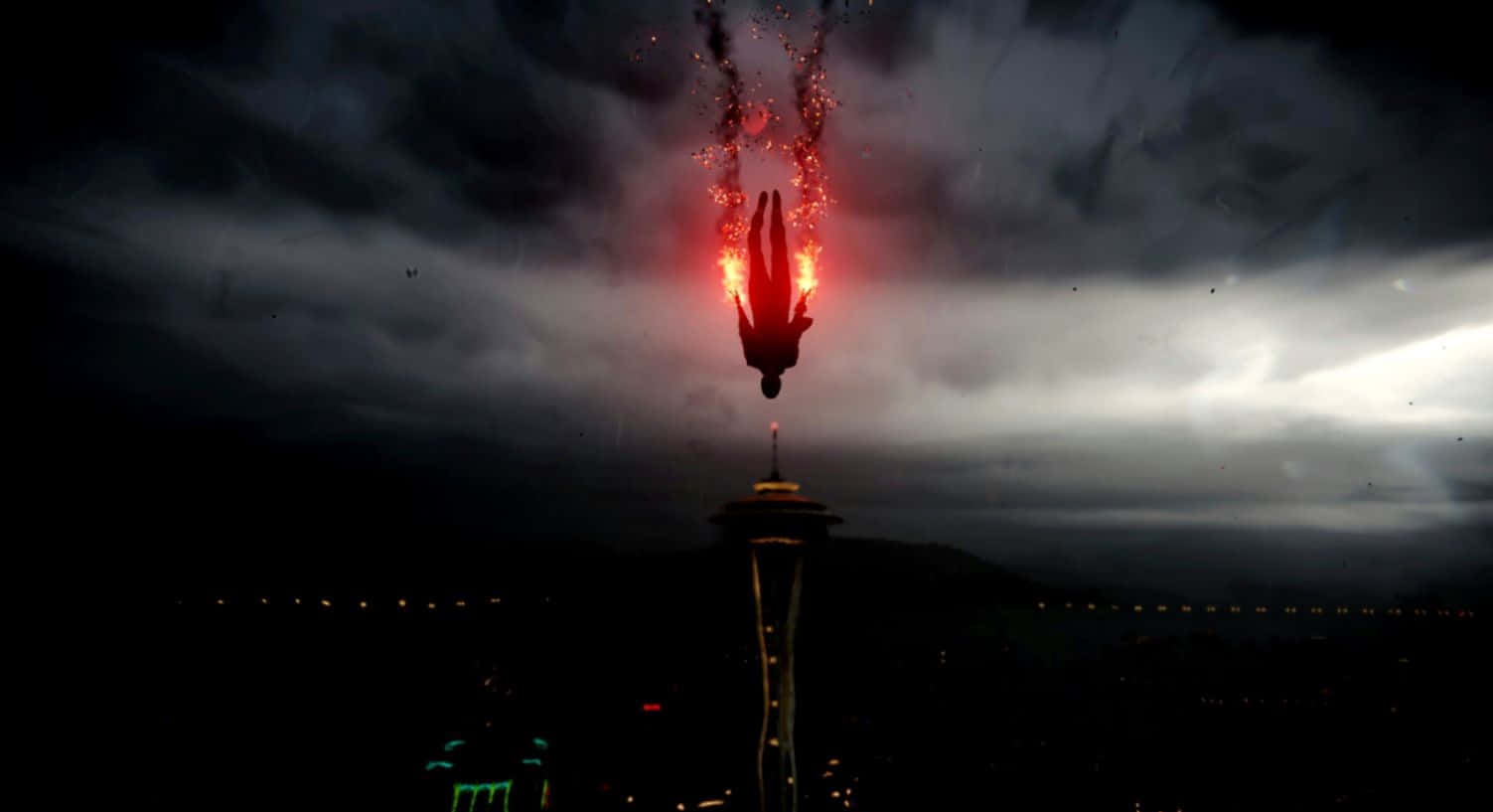 《Infamous》角色行動瞬間 壁紙 — 一個火熱的人影從西雅圖太空針塔墜落，背景是暴風雨的夜空，伴隨著發光的紅色火花。