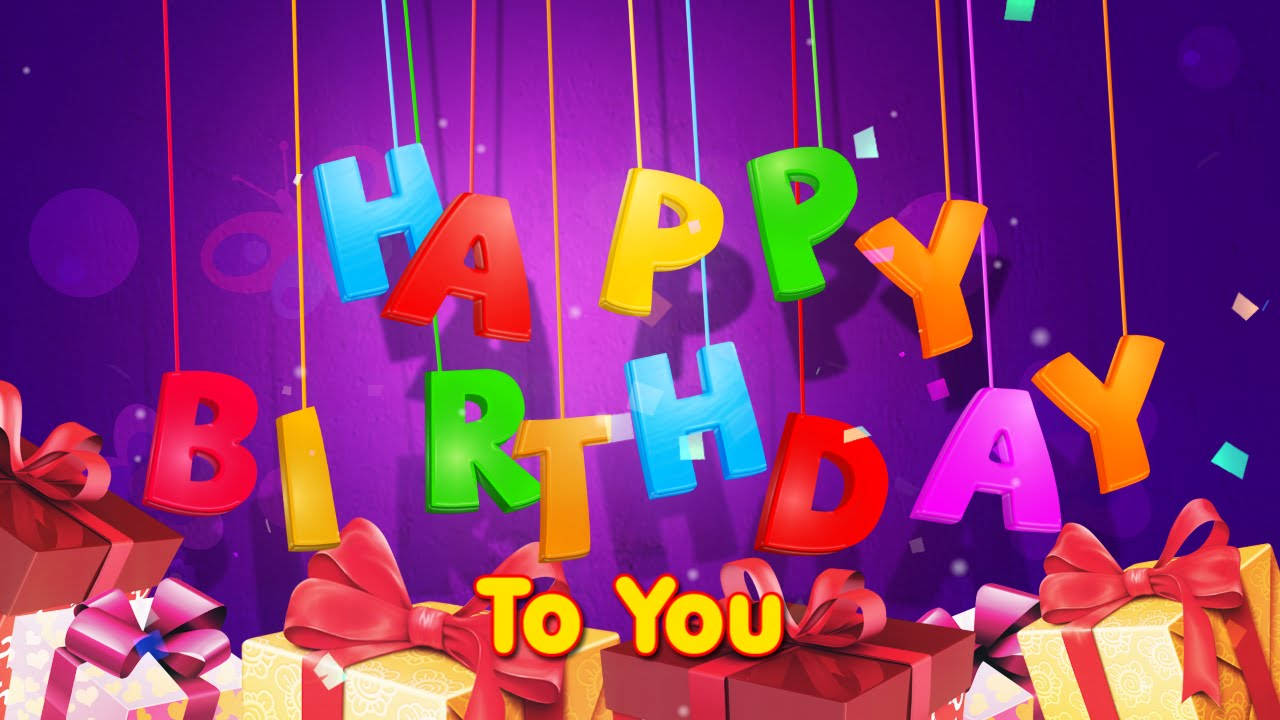 Happy Birthday文字懸掛在帶有紅色蝴蝶結的禮物盒上方，背景為紫色。