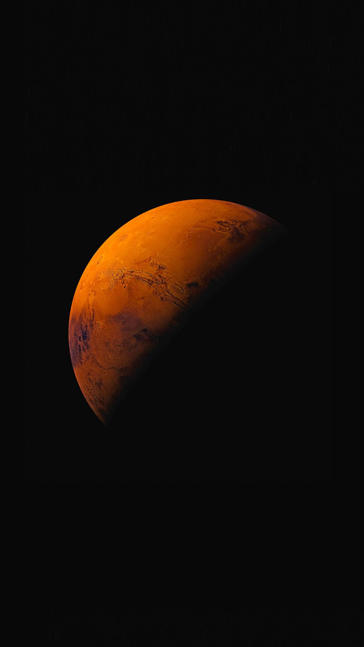 iOS 1 火星棕色行星 壁紙 — 火星在黑色太空虛空中發出橙色光芒的壯麗景色，表面細節清晰可見。