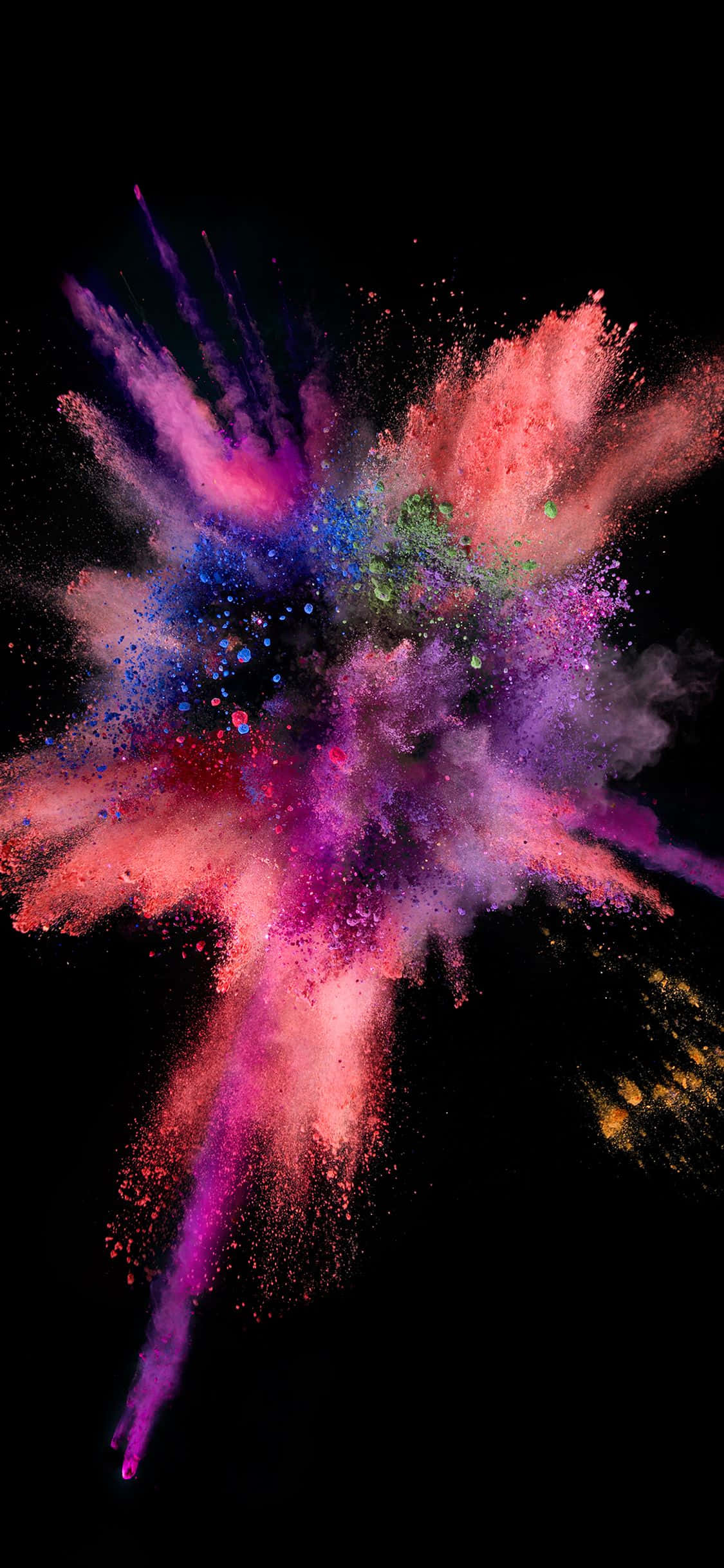 iOS 1 粉紅色油漆爆裂 壁紙 — 鮮豔的彩色粉末在純黑色背景上動態爆炸，呈現出粉紅色、紫色、藍色和橙色的驚人爆發。