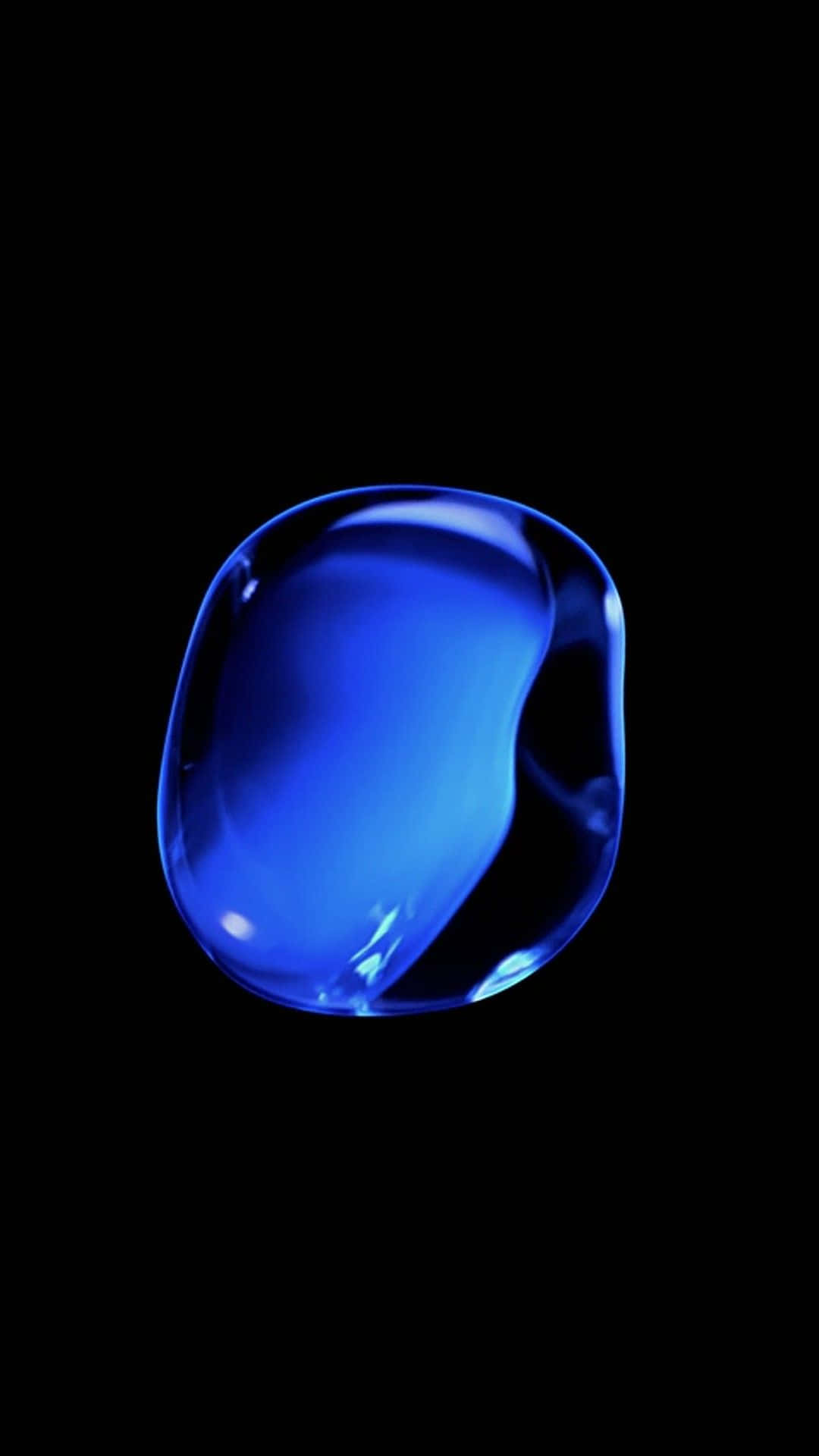 iOS 1 高光藍色氣泡 壁紙 — 懸浮在純黑虛空中的發光藍色液滴，散發內在光芒。