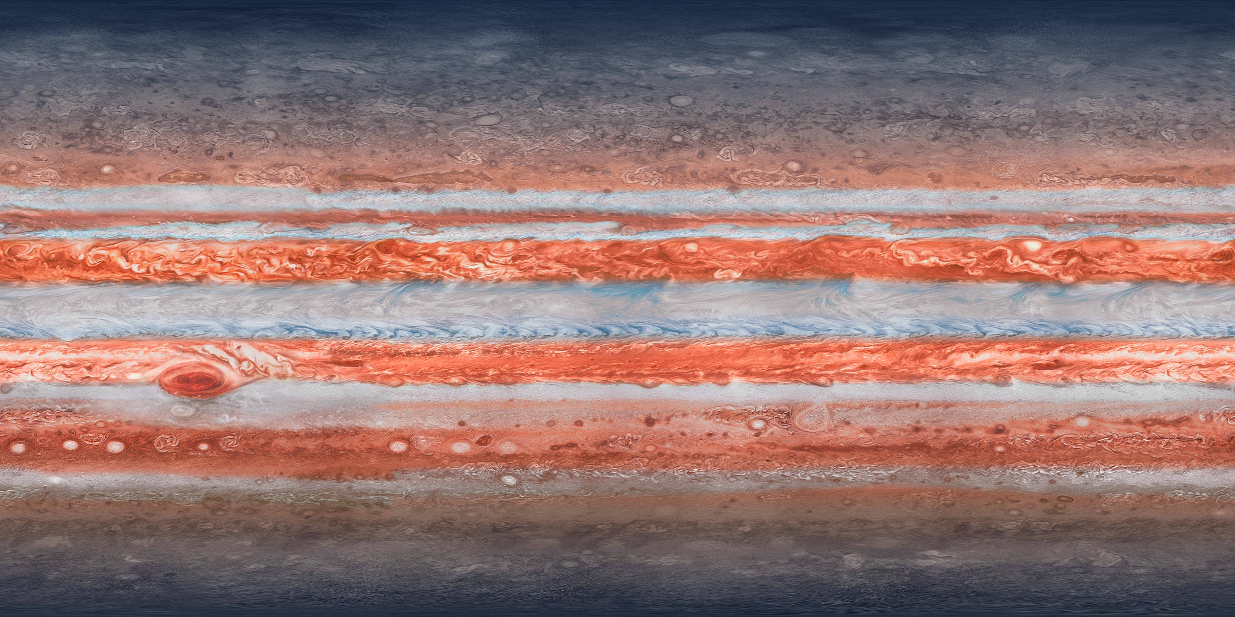 iPad Pro 木星表面 壁紙 — 木星大氣層漩渦帶的近距離視圖，呈現鮮豔的橙色、藍色和灰色色調。