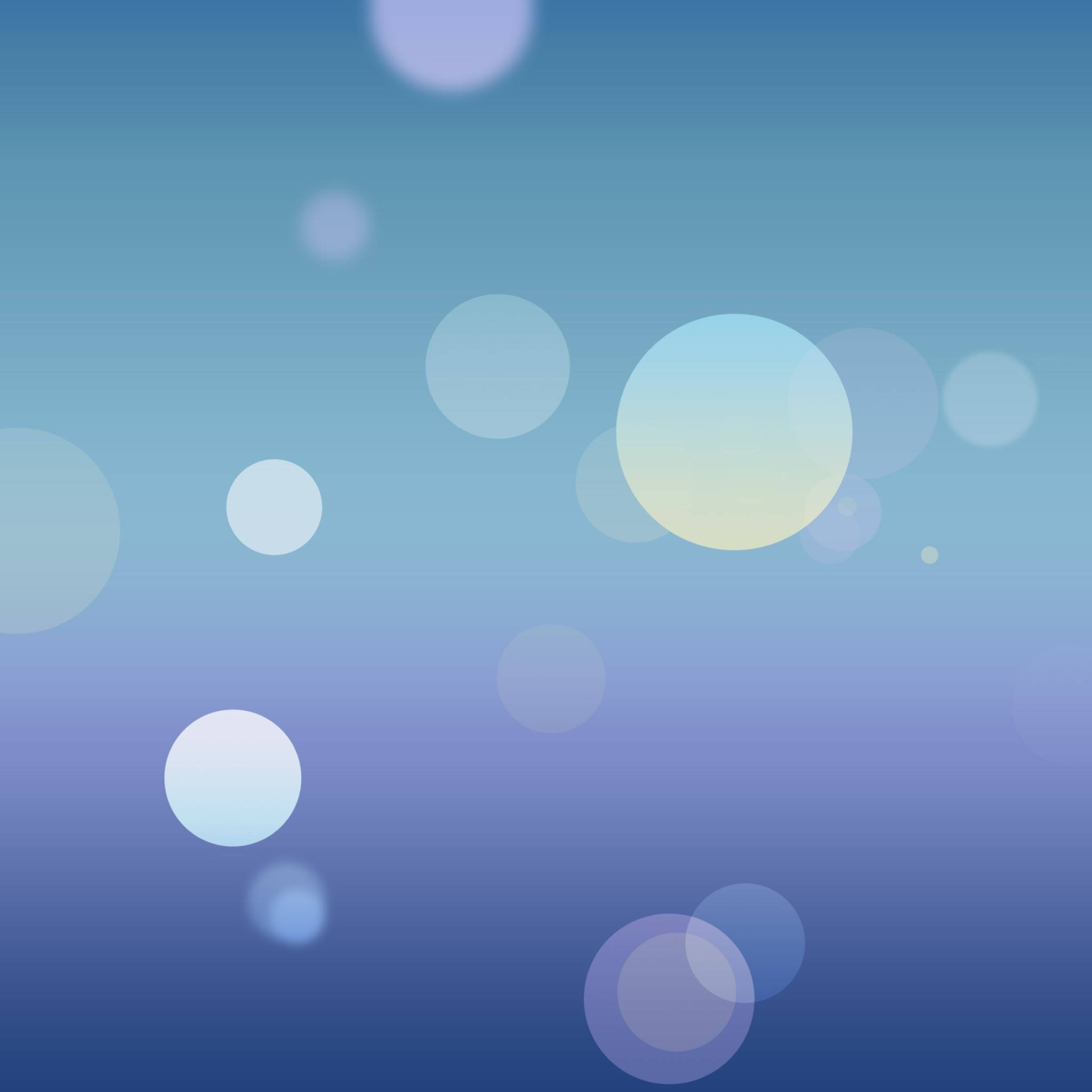 原版 iPhone 藍色圓圈背景 壁紙 — 柔和發光的球體漂浮在漸變藍色背景上，營造出夢幻縹緲的氛圍。