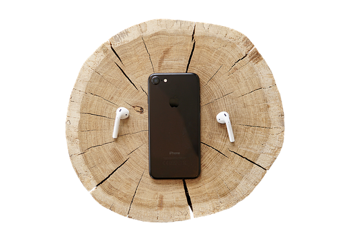 iPhone 與 AirPods 在木質背景上 壁紙