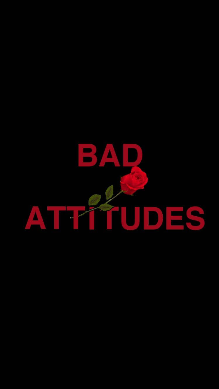 iPhone Baddie 壞態度字樣 壁紙 — 粗體紅色文字顯示「bad attitudes」，一朵紅玫瑰穿過文字，背景為純黑色。