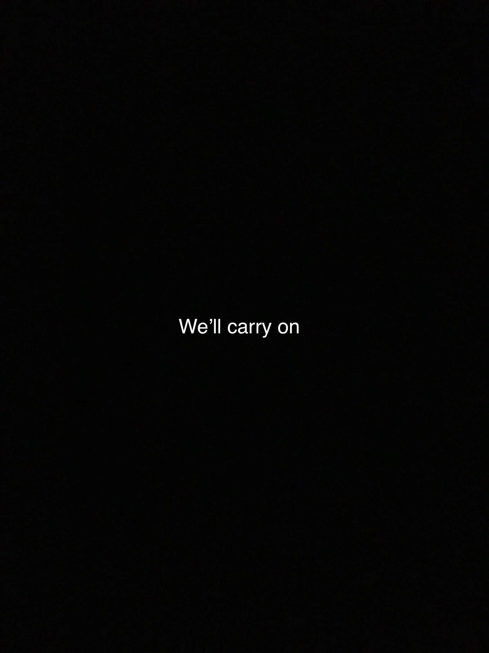 簡約黑白風格 iPhone 鼓舞人心語錄 壁紙 — 白色文字顯示「We'll carry on」，居中於純黑色背景上。