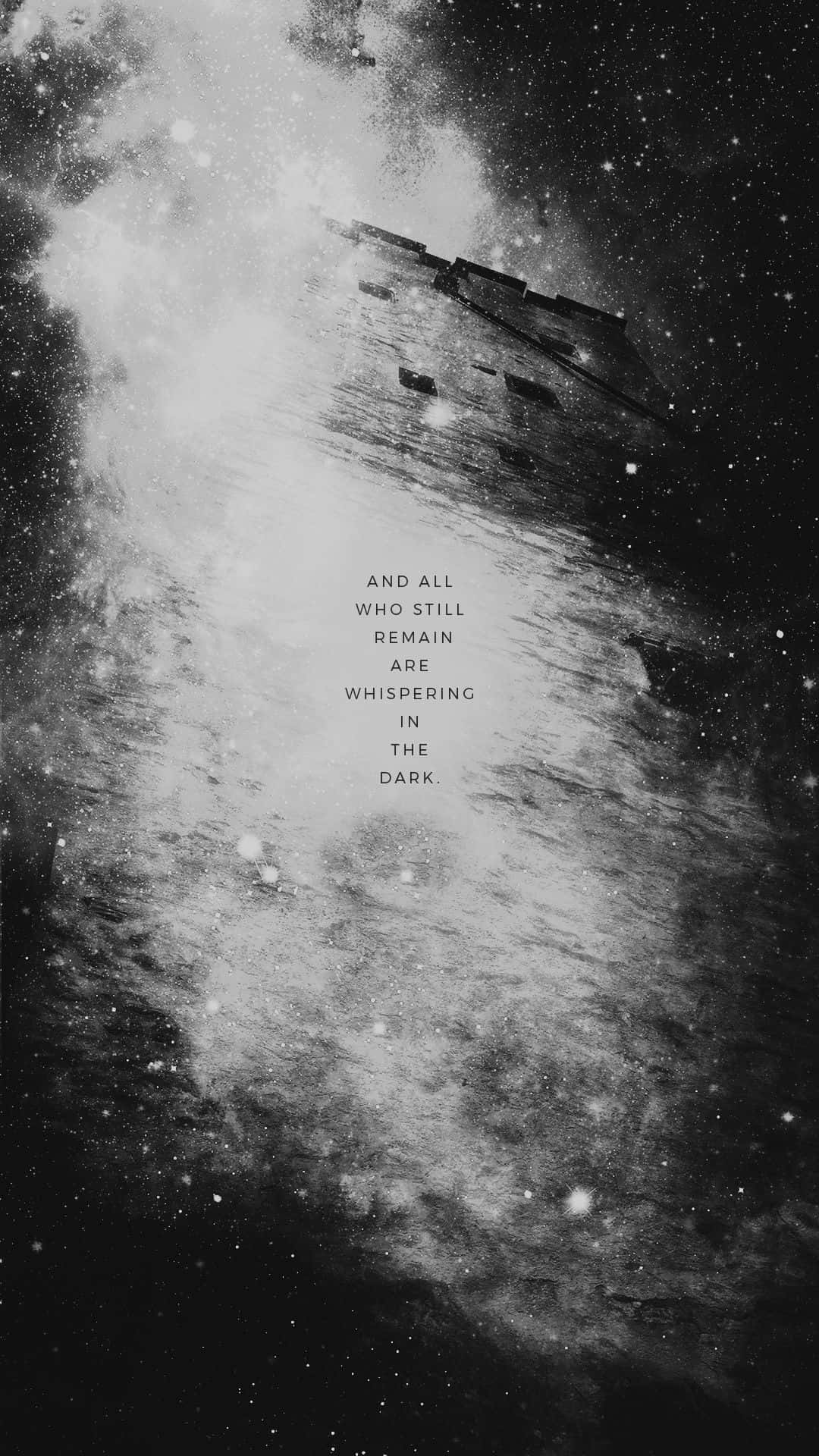 簡約黑白風格 iPhone 歌詞：In This Moment 壁紙 — 單色宇宙場景，碎片結構漂浮在星場和星雲中，並帶有文字疊加。
