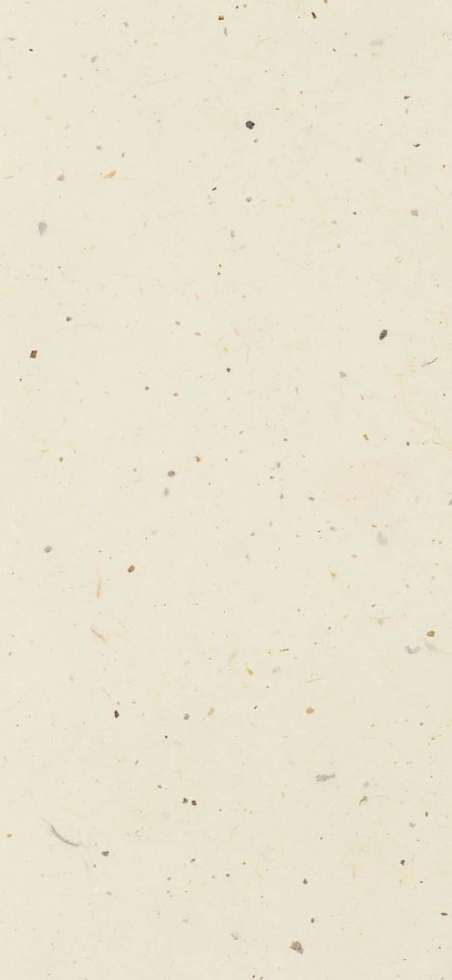 iPhone X 最簡約斑點背景 壁紙 — 奶油色米白紙張的特寫，帶有散落的天然纖維斑點和微弱的有機污漬。