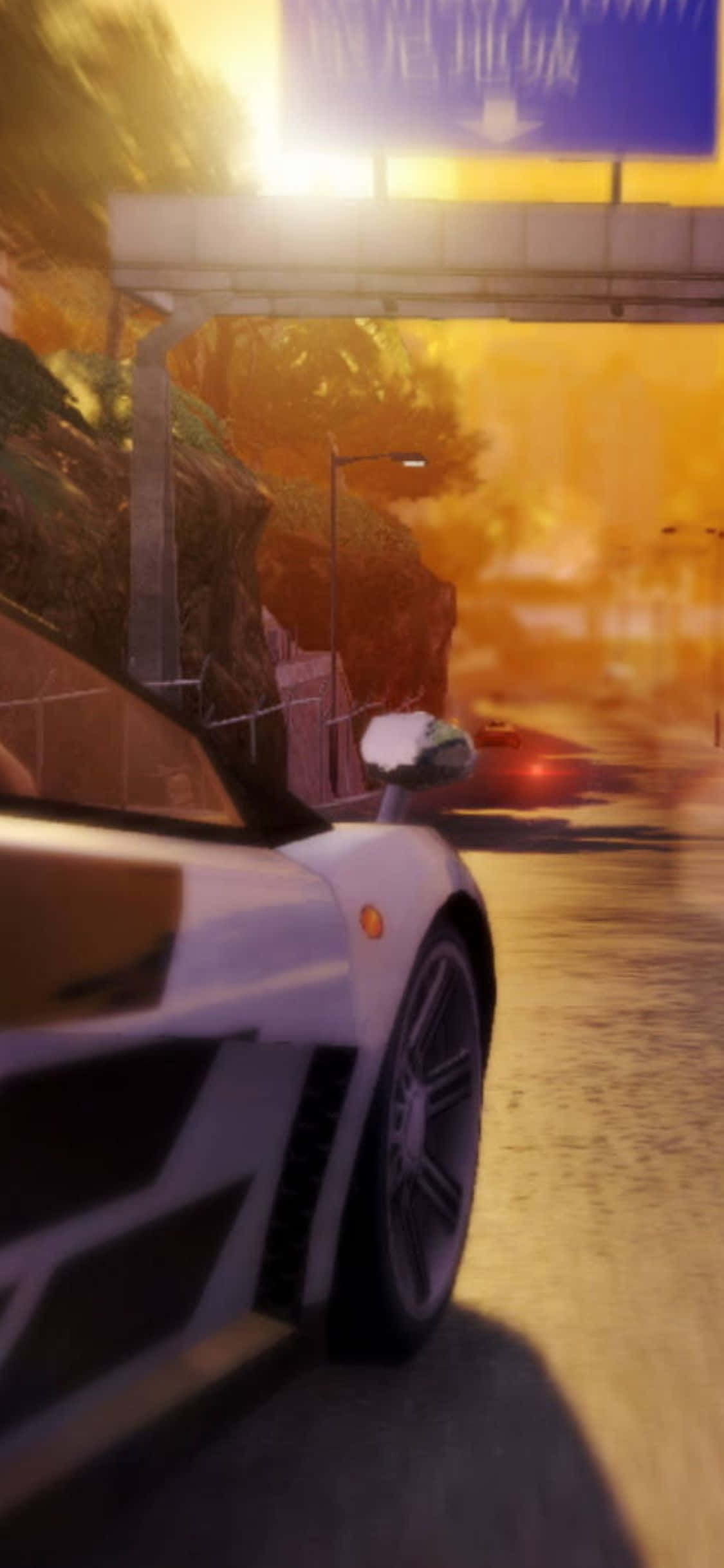 iPhone XS《Sleeping Dogs》魏閔賽車背景 壁紙 — 一輛白色跑車在日落時分，在發光的橙色高速公路天橋下高速行駛，帶有動態模糊效果。