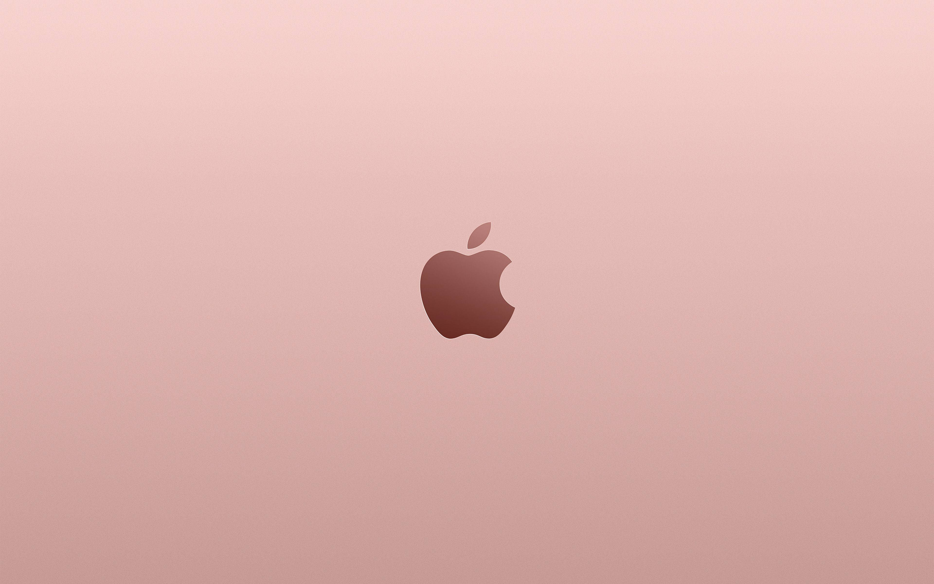 玫瑰金iPhone標誌美學Mac壁紙 壁紙 — 一個極簡玫瑰金色 Apple 標誌，置於柔和漸變背景中央。