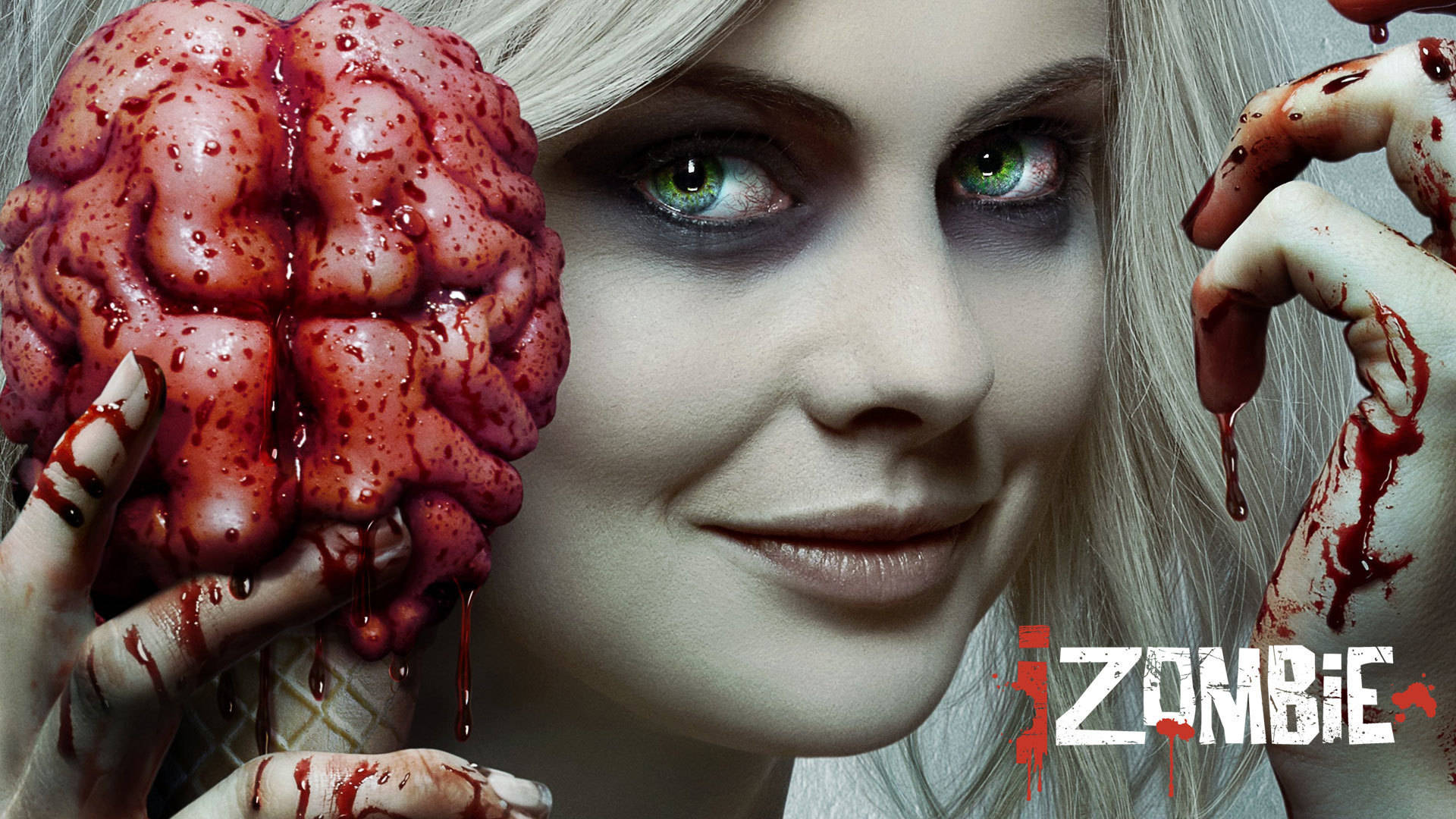 《iZombie》莉芙·摩爾特寫 壁紙 — 一位蒼白、綠眼睛的女人拿著一個沾滿血的腦放在雪糕筒上，血從她的手滴落。