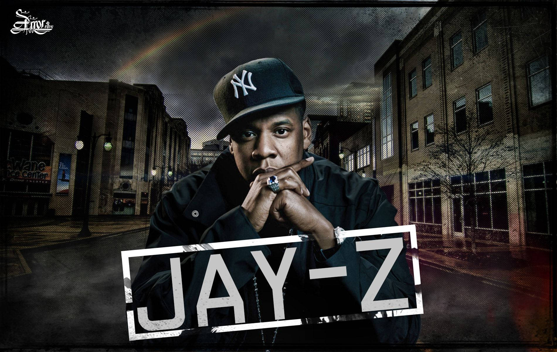 Jay-Z 背景為建築物 壁紙 — Jay-Z 喺黑暗天空下帶住微弱彩虹嘅粗糙城市街道場景中，強烈咁凝視住鏡頭。