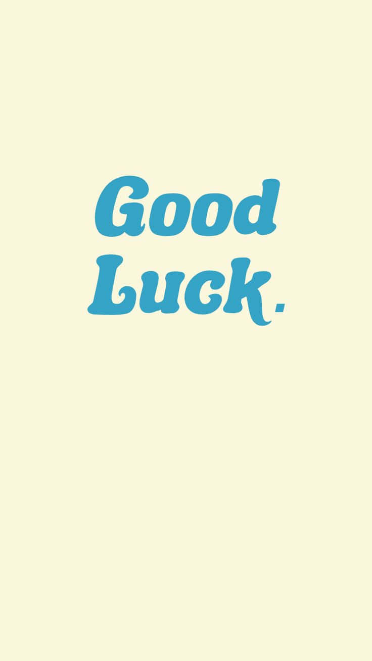 壁紙 — 簡約風格牆紙，淺黃色背景中央有藍色草書文字 'Good Luck'。