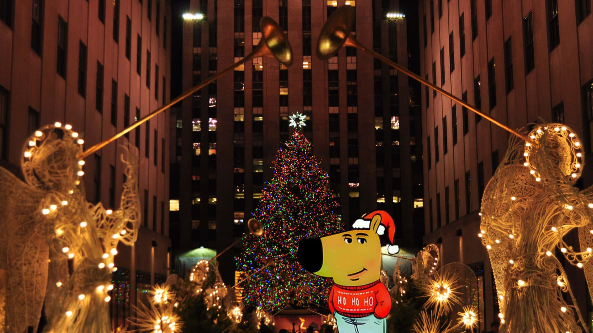  壁紙 — 一個節日夜晚的城市場景，有一隻戴著聖誕帽的巨大卡通狗站在一棵燈火通明的聖誕樹前，兩側是發光的天使雕塑。