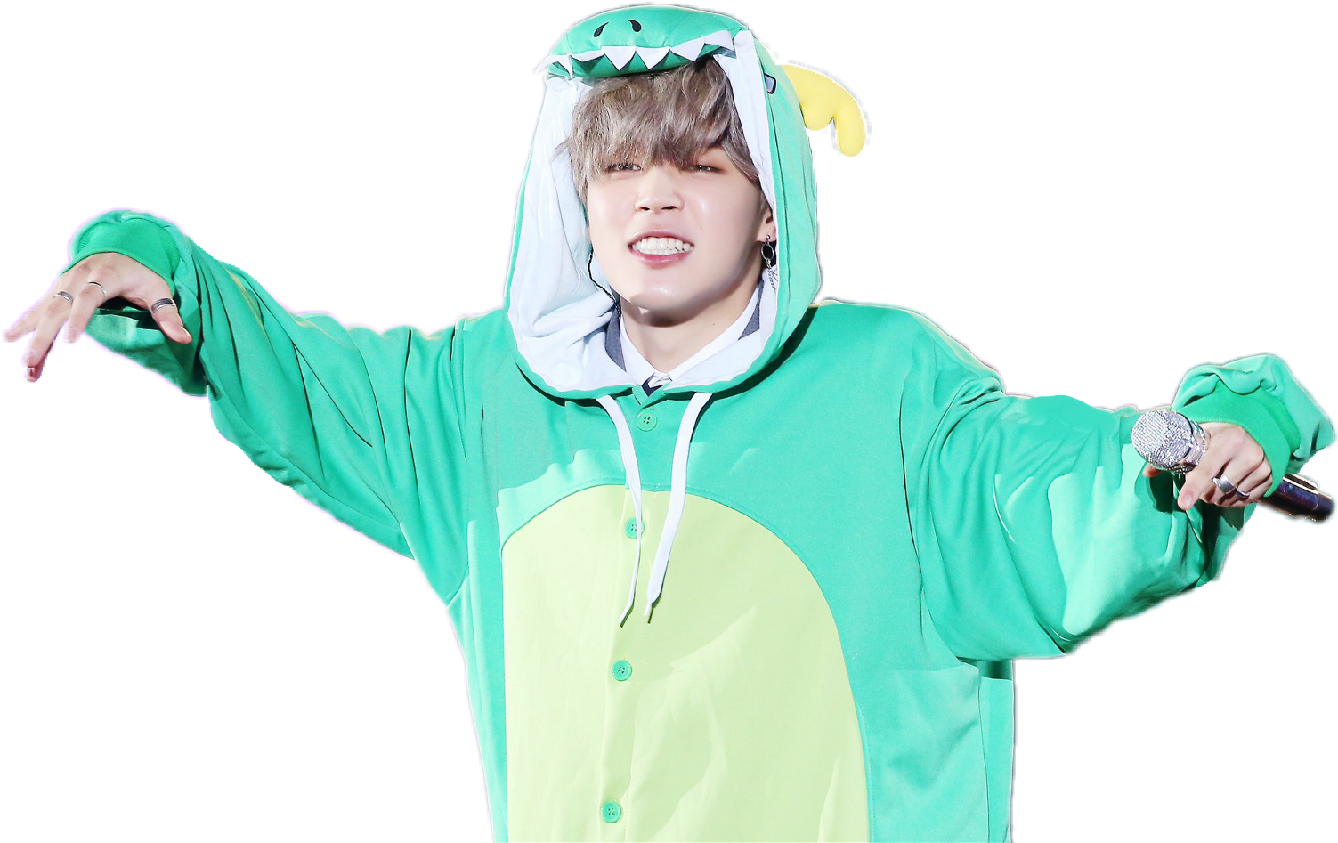 Jiminin恐龍連帽衫表演 壁紙 — 一位穿著亮綠色恐龍連身衣的表演者微笑著，雙臂張開，手持麥克風。