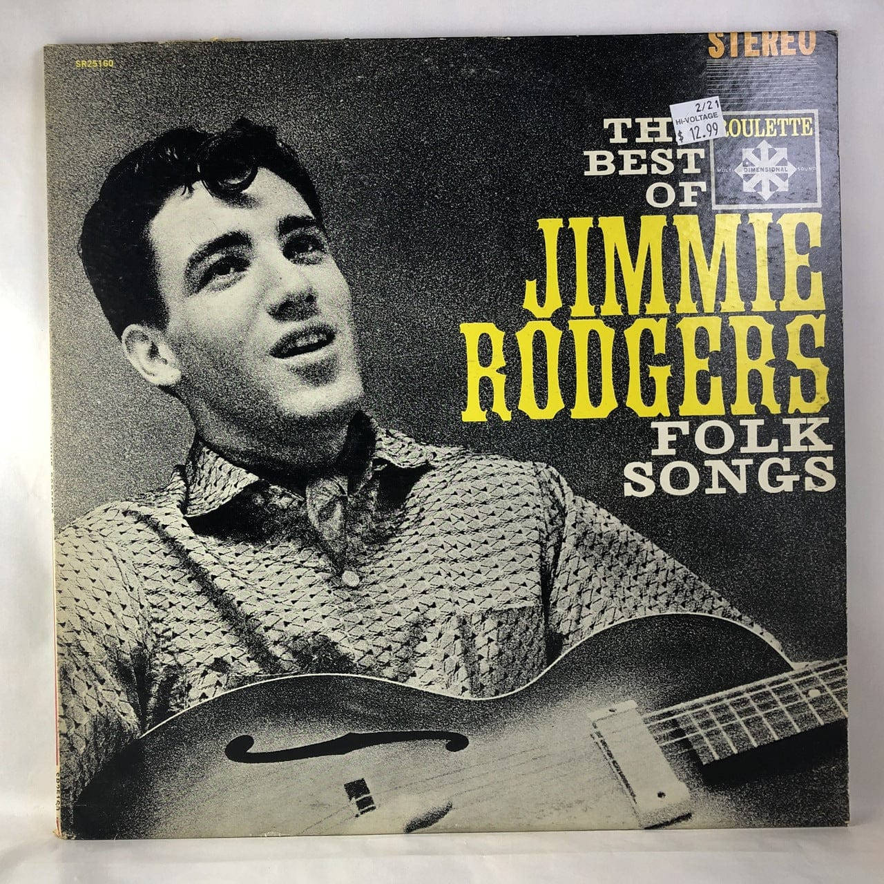 Jimmie Rodgers 精選專輯封面 壁紙 — Jimmie Rodgers 手持結他的復古黑白專輯封面，帶有粗體黃色文字。