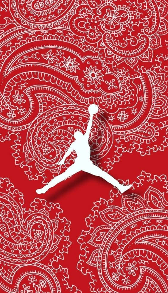 白色籃球運動員剪影在紅色佩斯利背景上入樽。