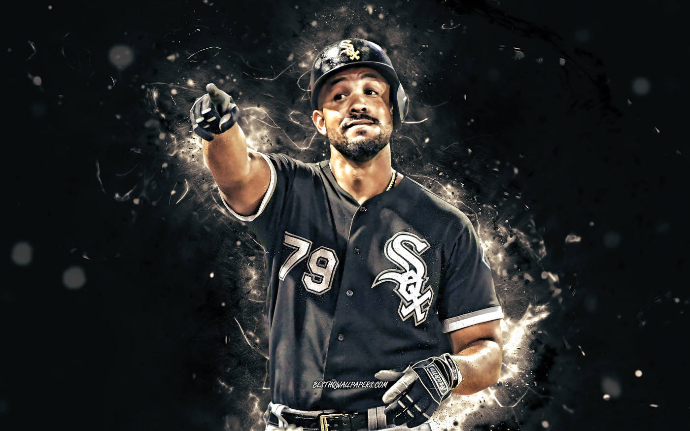 Jose Abreu 指向觀眾 壁紙 — 一名身穿芝加哥白襪黑色球衣、背號79的棒球選手向前指，發光粒子在他周圍爆炸，背景為深色。