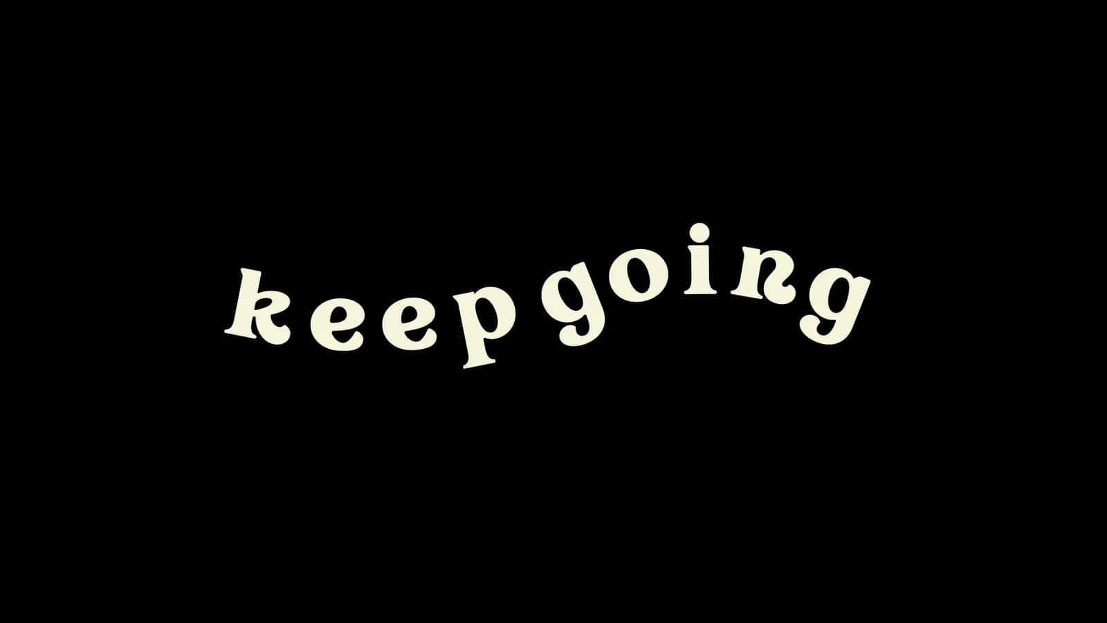 黑白美學 桌布 壁紙 — 「keep going」呢句短語以奶油色字體喺純黑色背景上發光。