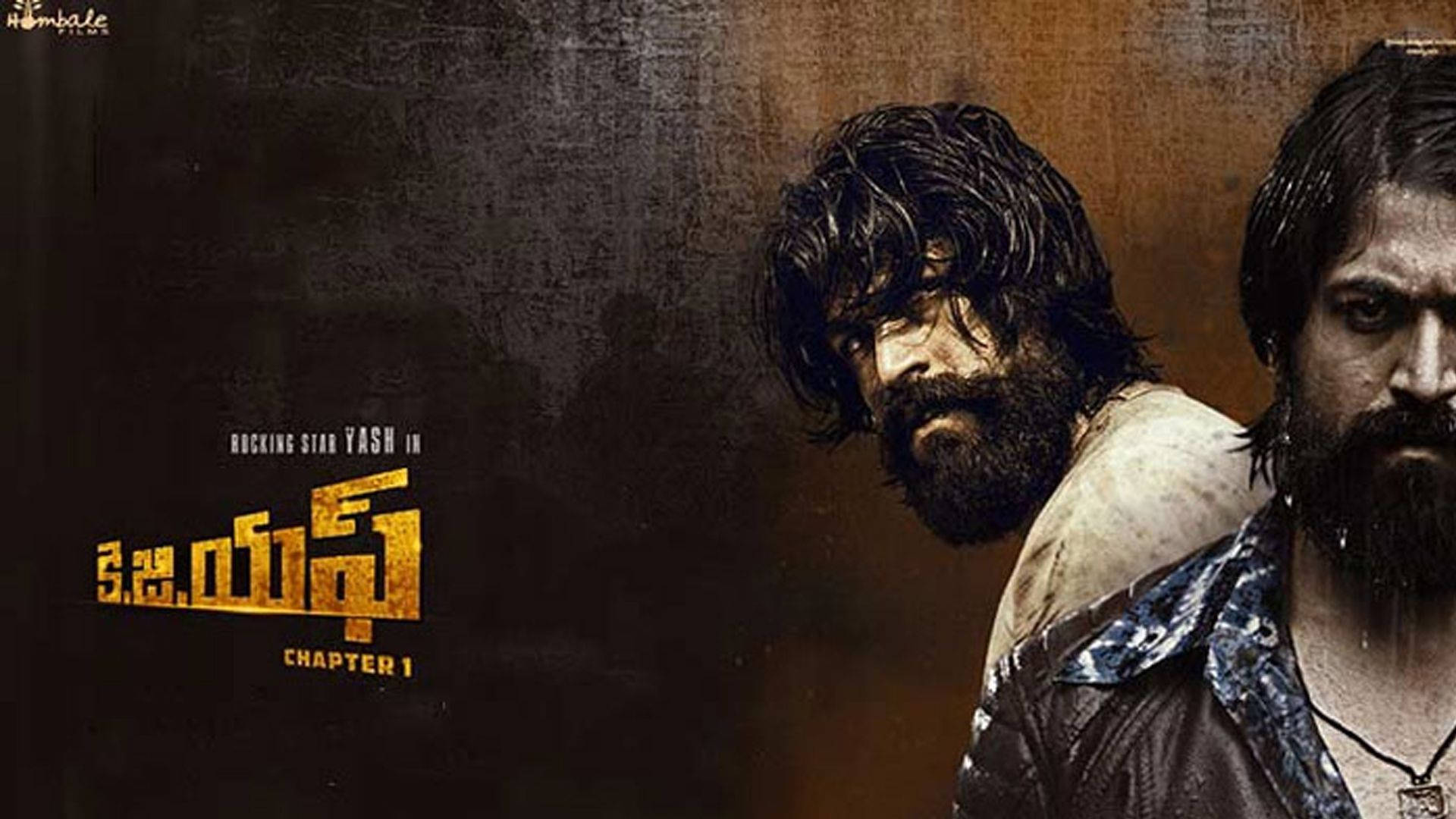 KGF 第一章 Rocky 的雙面人生 壁紙 — 兩位鬍鬚男表情強烈，直視前方，背景粗糙有紋理，並有粗體金色泰米爾文文字。