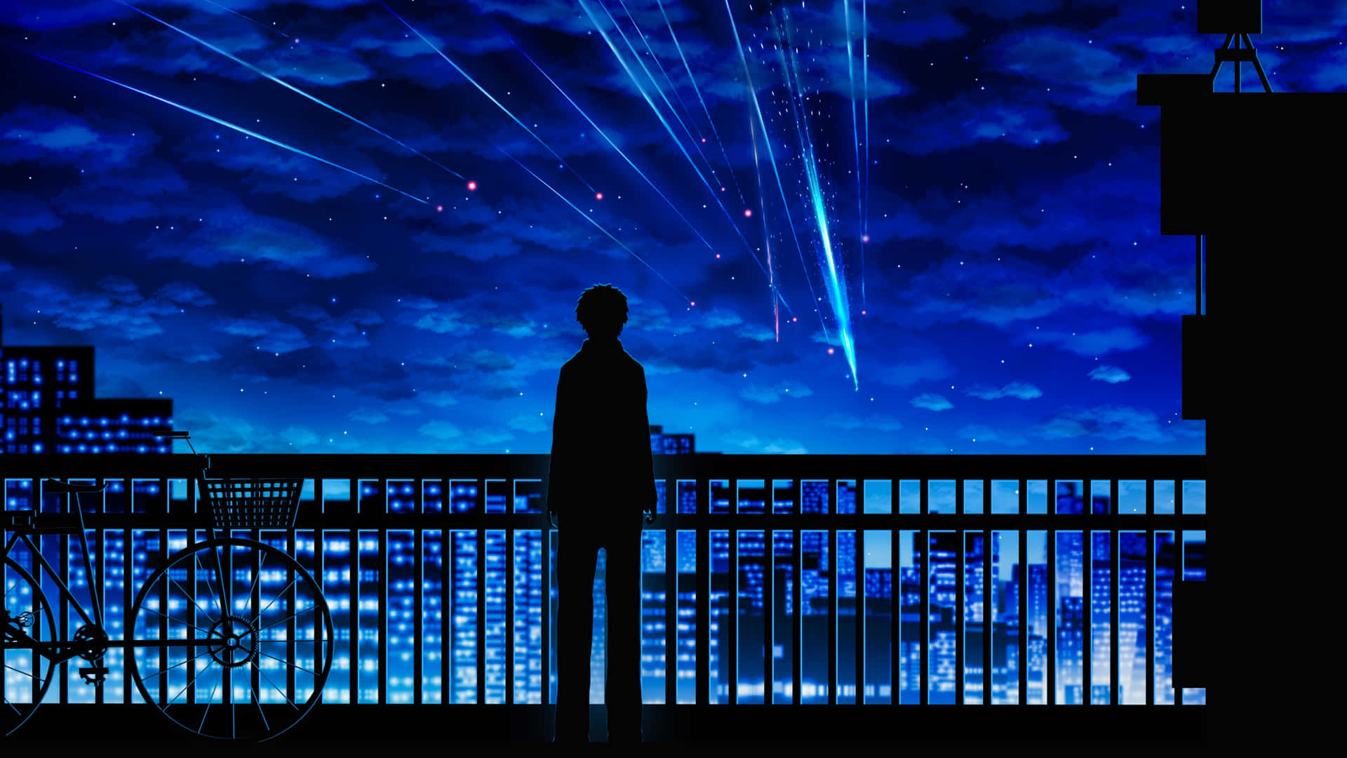 夜晚站在陽台上觀看城市燈光上方發光的宇宙射線的人