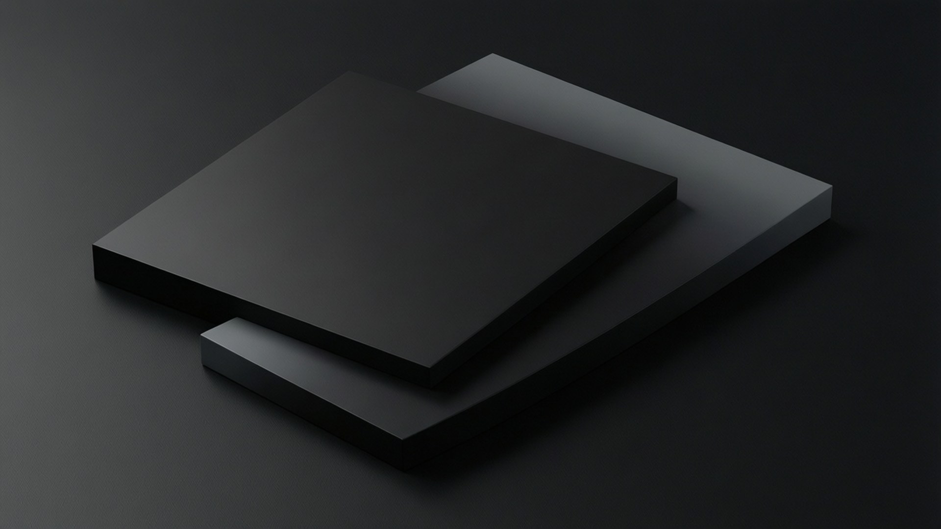 Layered Black Geometry 壁紙 — 兩個啞光黑色矩形塊以一定角度堆疊在帶有柔和陰影的深色表面上。